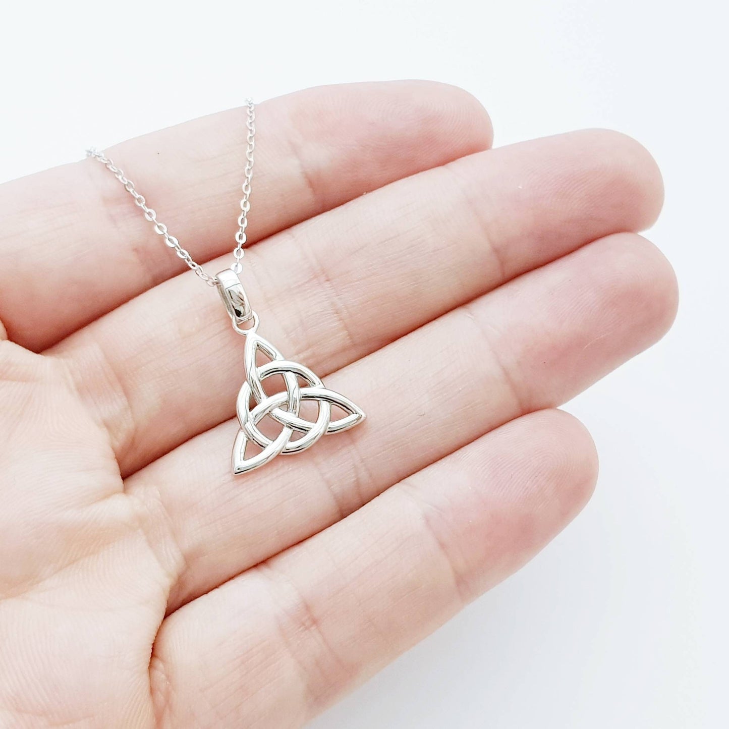 Double sided celtic knot pendant, silver triquetra celtic necklace made in Ireland with angel wing chain