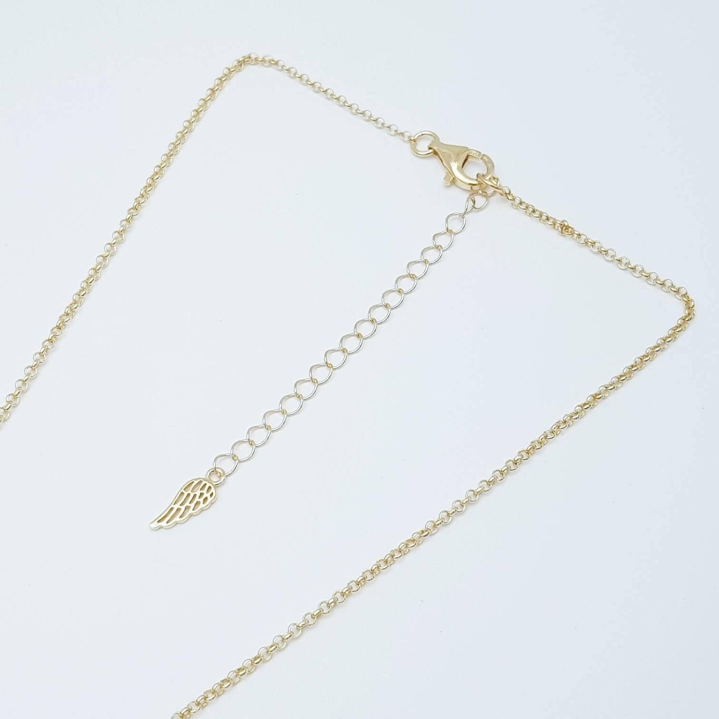 Silver and gold claddagh pendant with Aquamarine blue stone