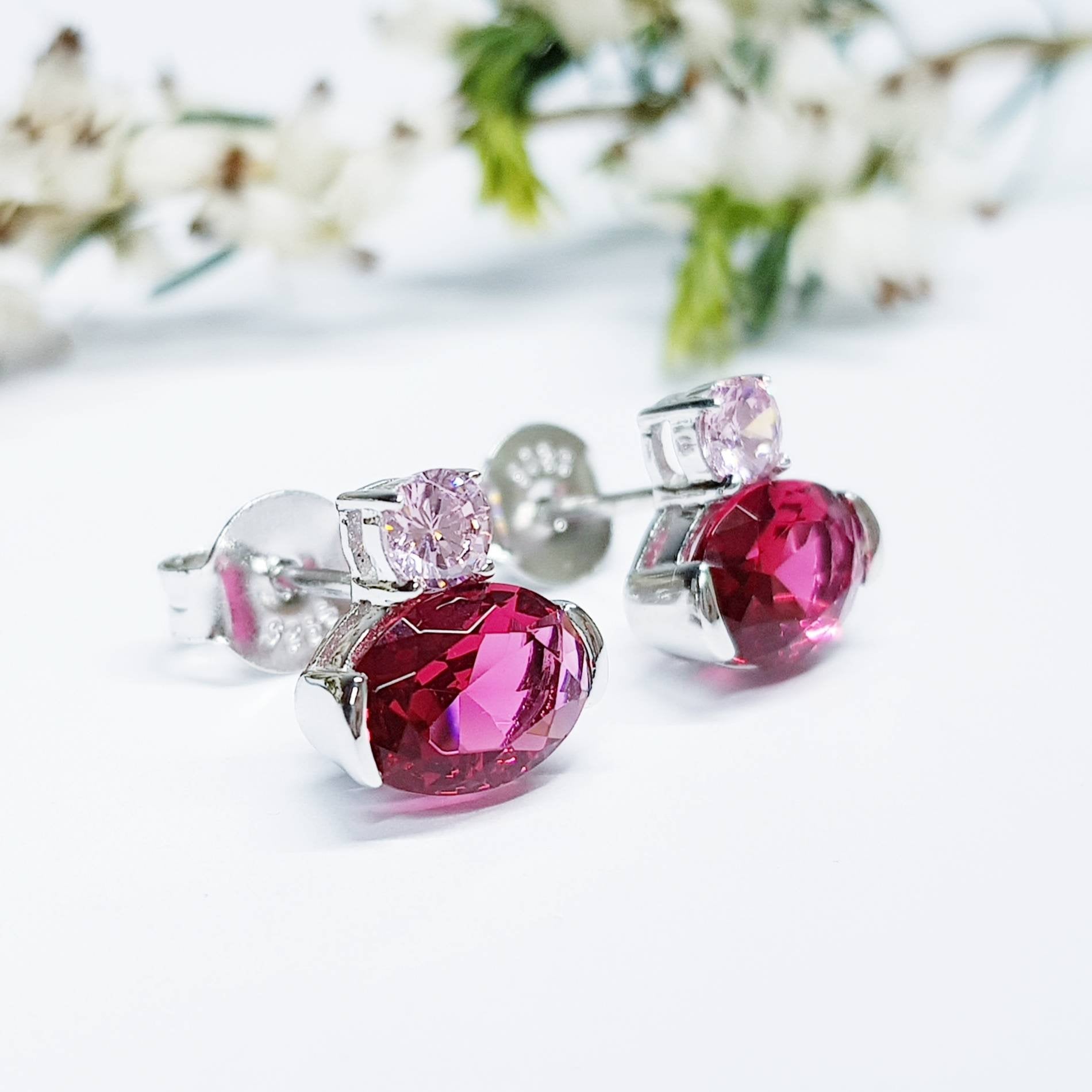 Sterling silver studs set with ruby red and pink cubic zirconia