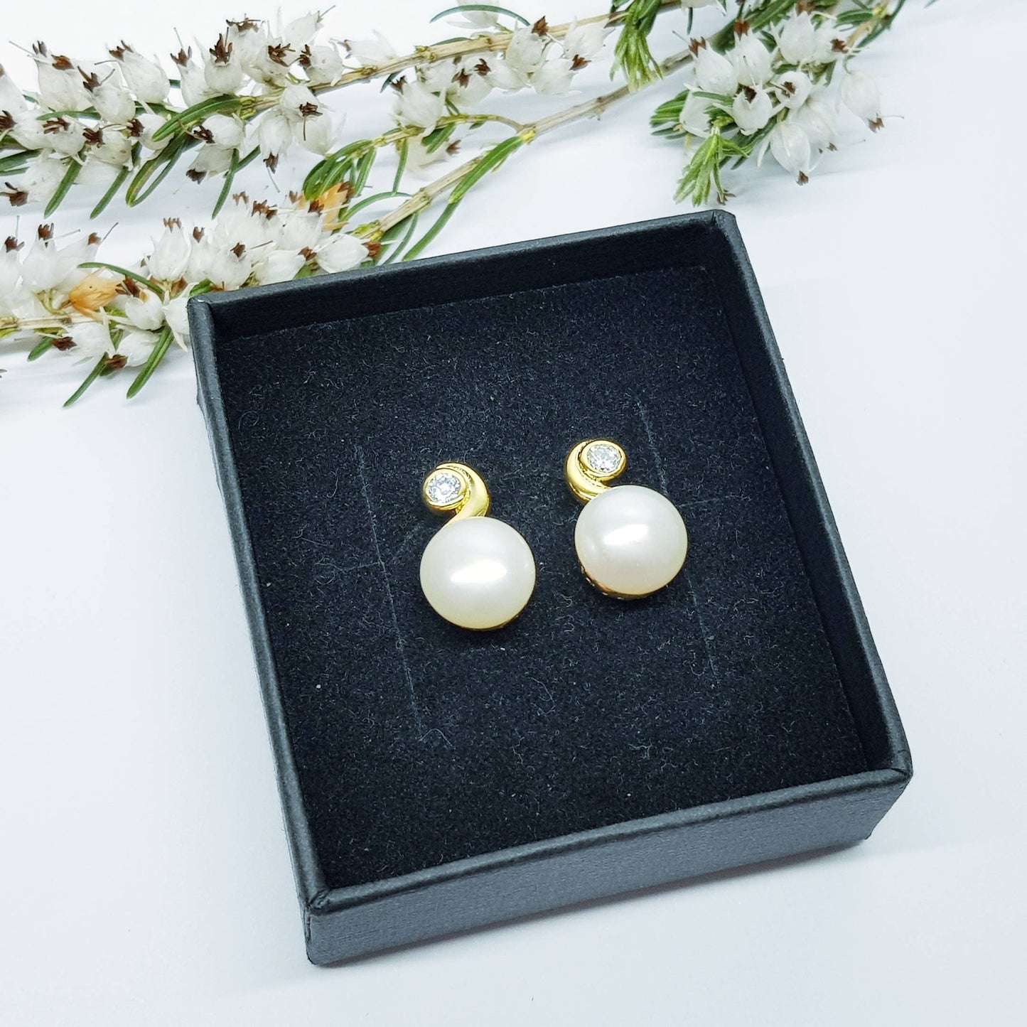 Gold plated sterling silver stud earrings with freshwater pearl