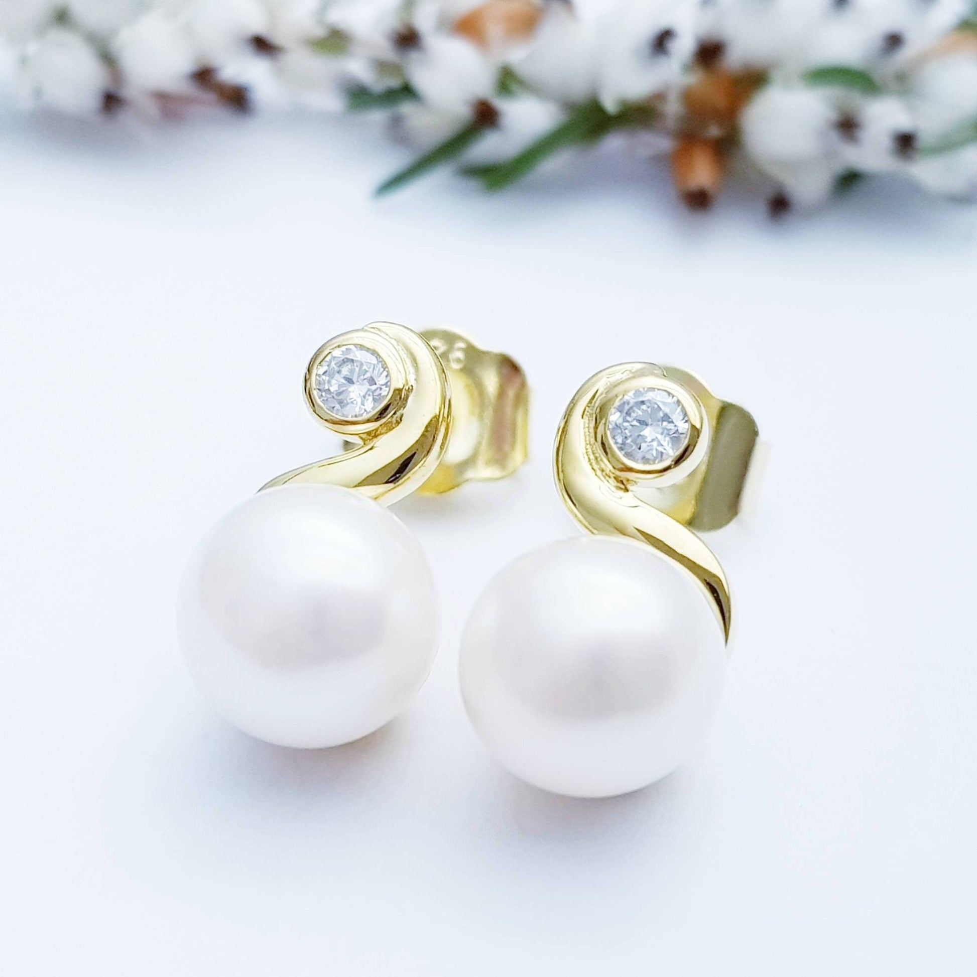 Gold plated sterling silver stud earrings with freshwater pearl