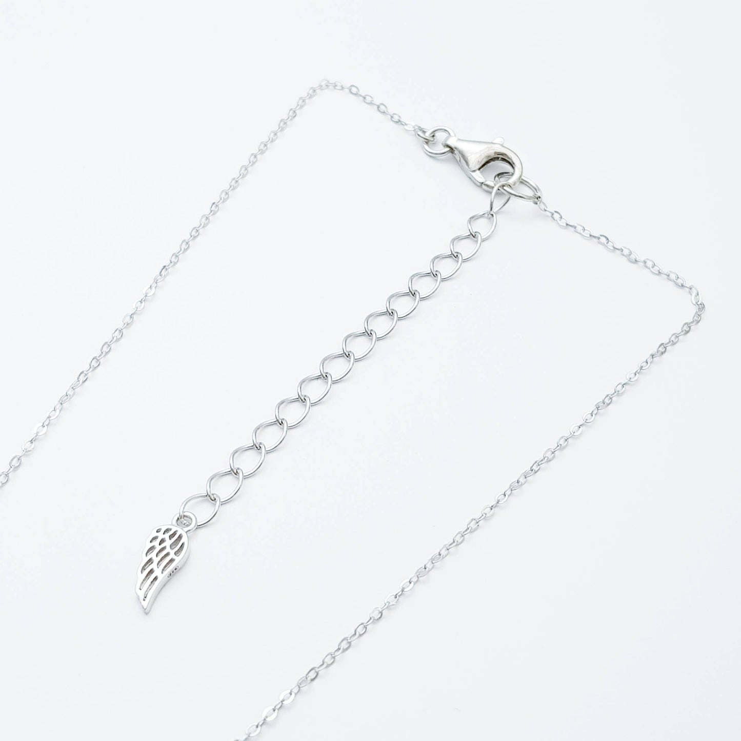 Double sided celtic knot pendant, silver triquetra celtic necklace made in Ireland with angel wing chain