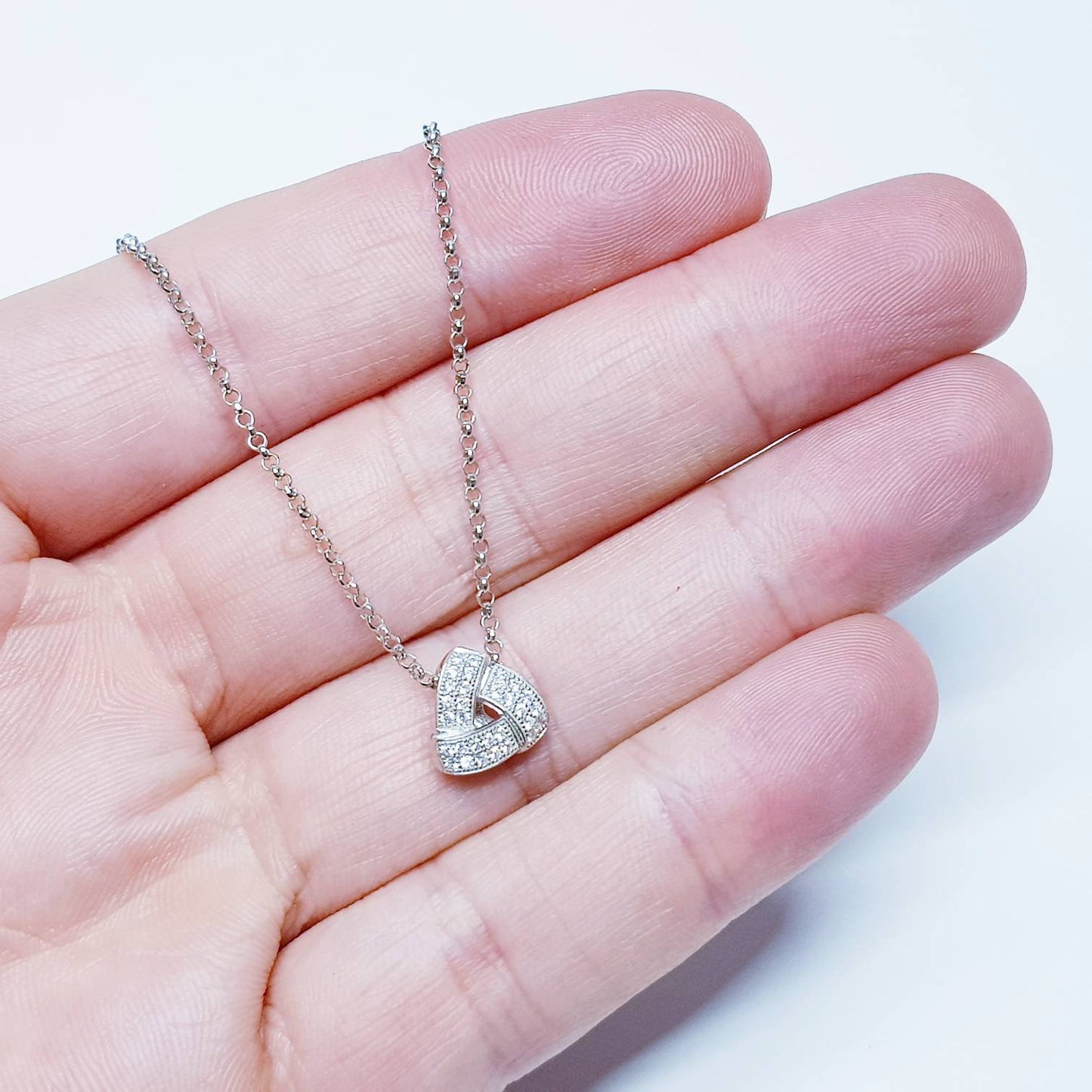 Small dainty necklace floating on sterling silver chain