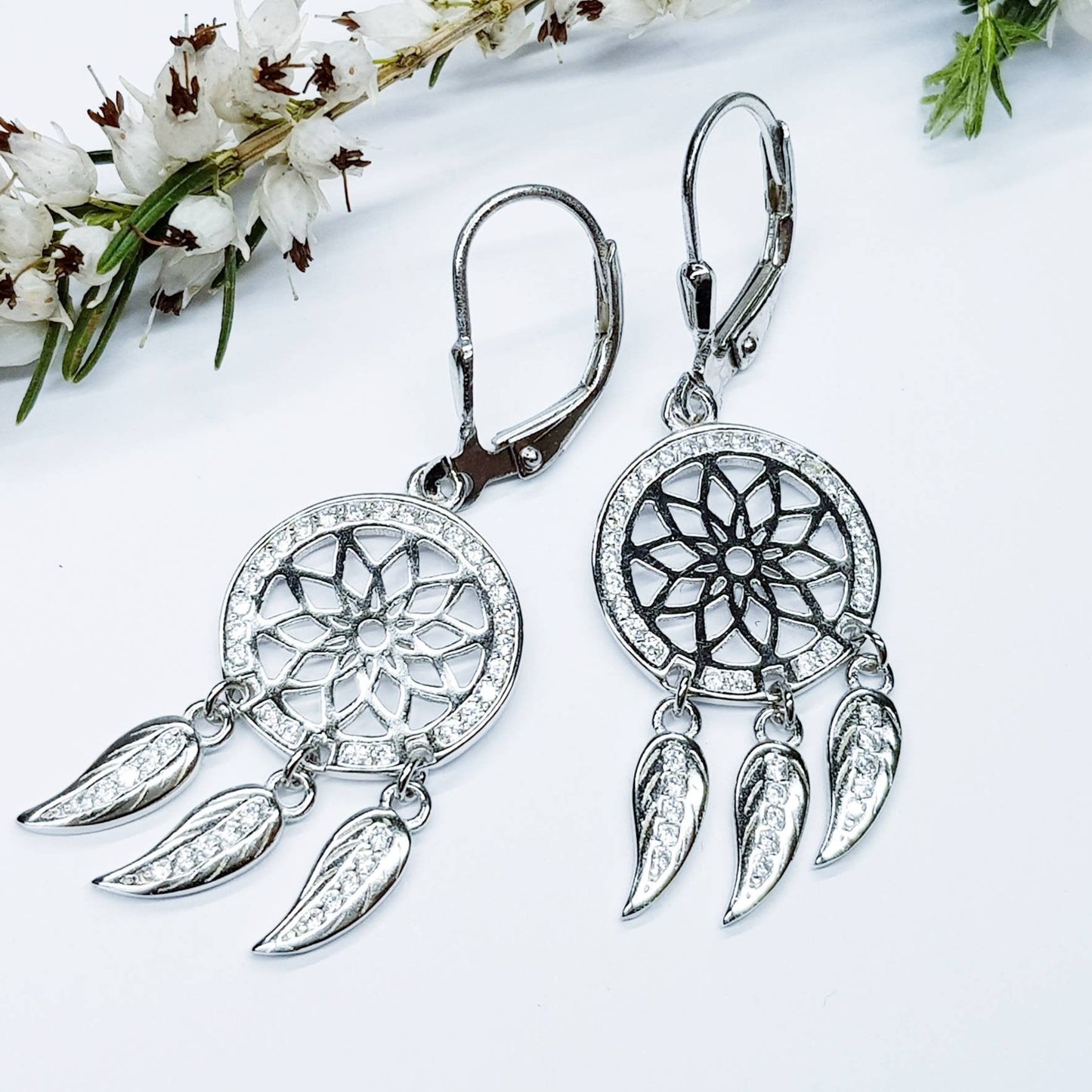 Sterling Silver drop earrings with sun symbol and dangling leaves