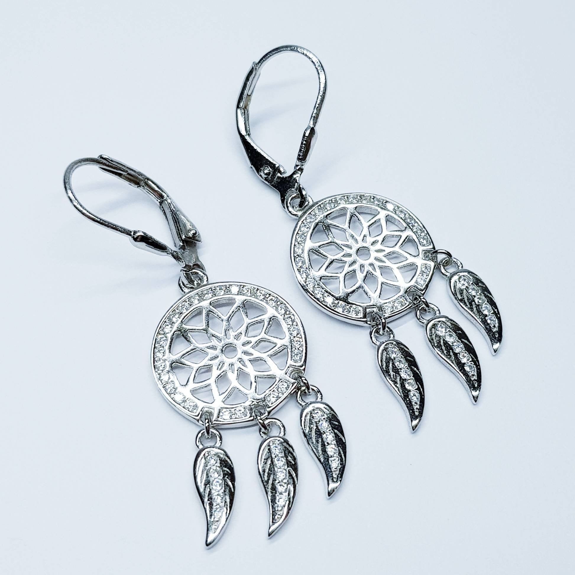 Sterling Silver drop earrings with sun symbol and dangling leaves