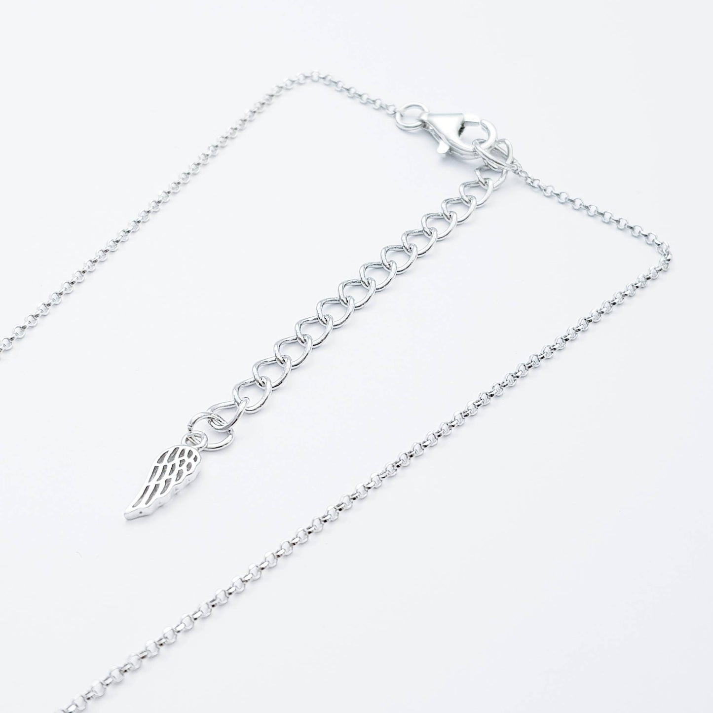 Sterling silver claddagh necklace set with electric blue December birthstone from Ireland