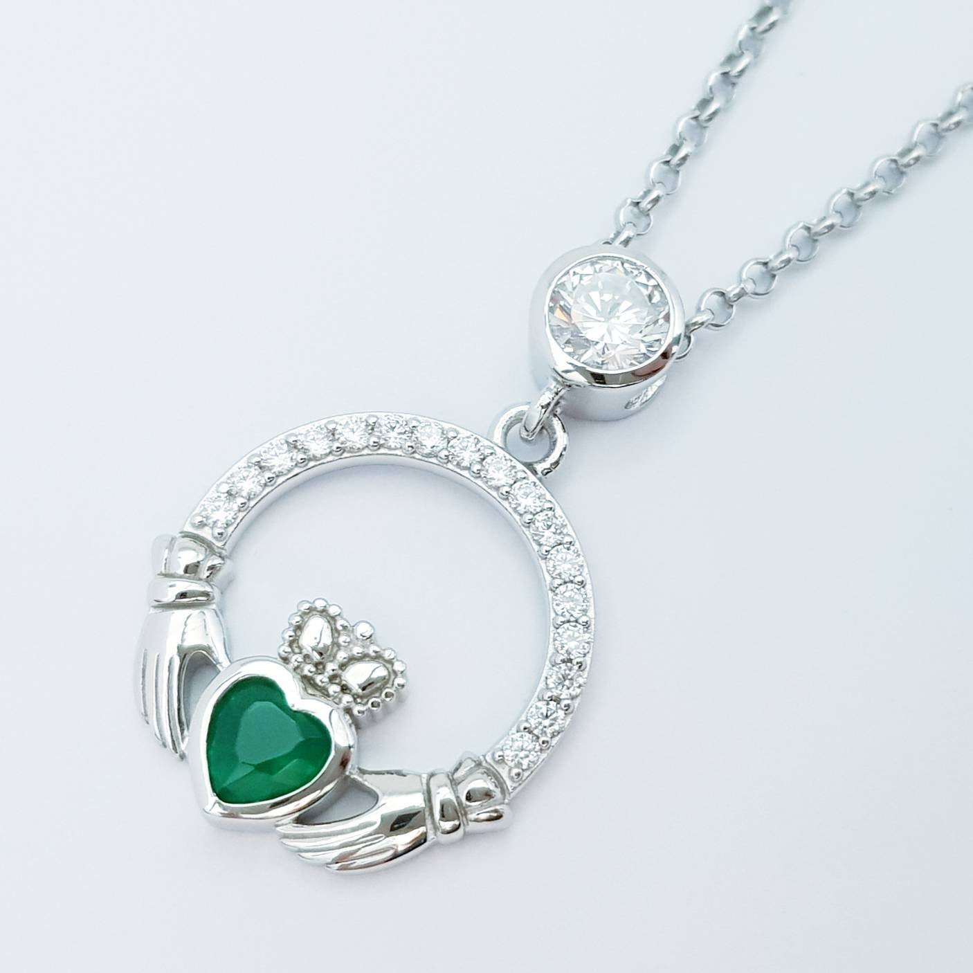 Sterling silver claddagh necklace with emerald green heart shaped stone