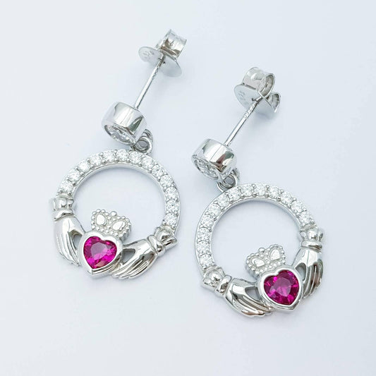 Silver claddagh drop earrings with red stone heart, July birthstone