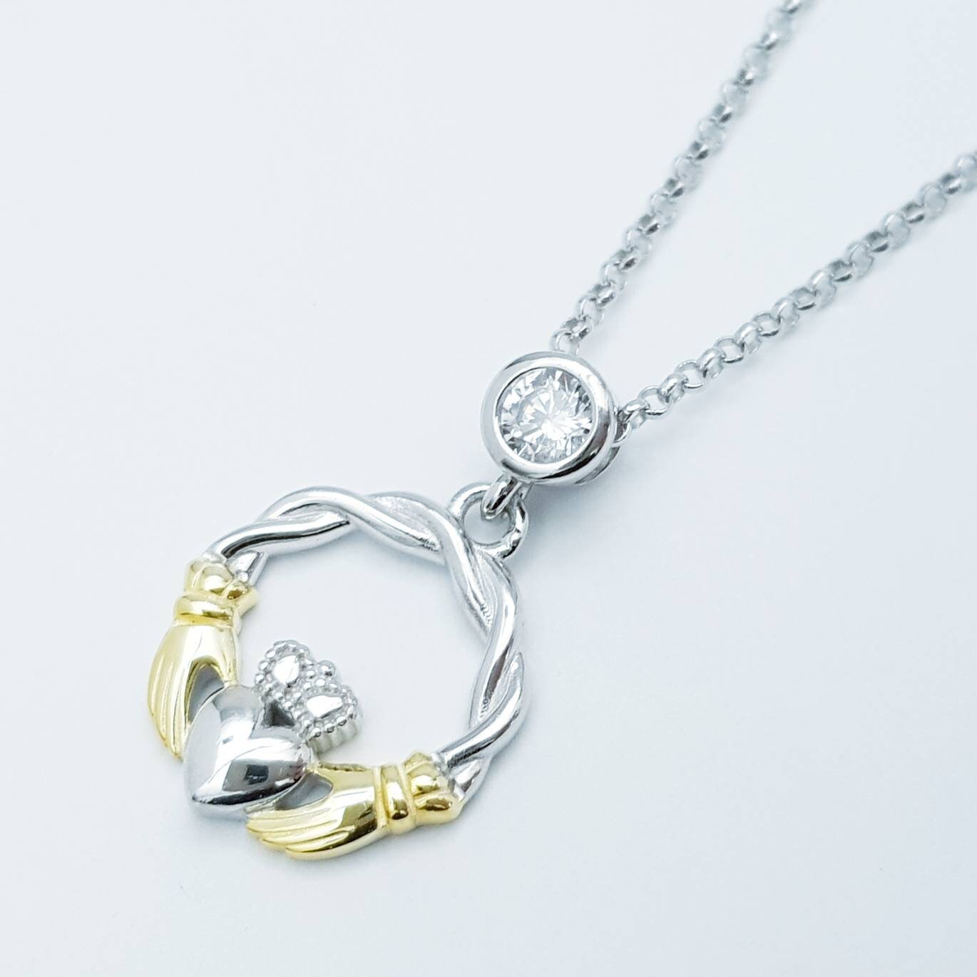 Cute Sterling Silver claddagh necklace with gold plating