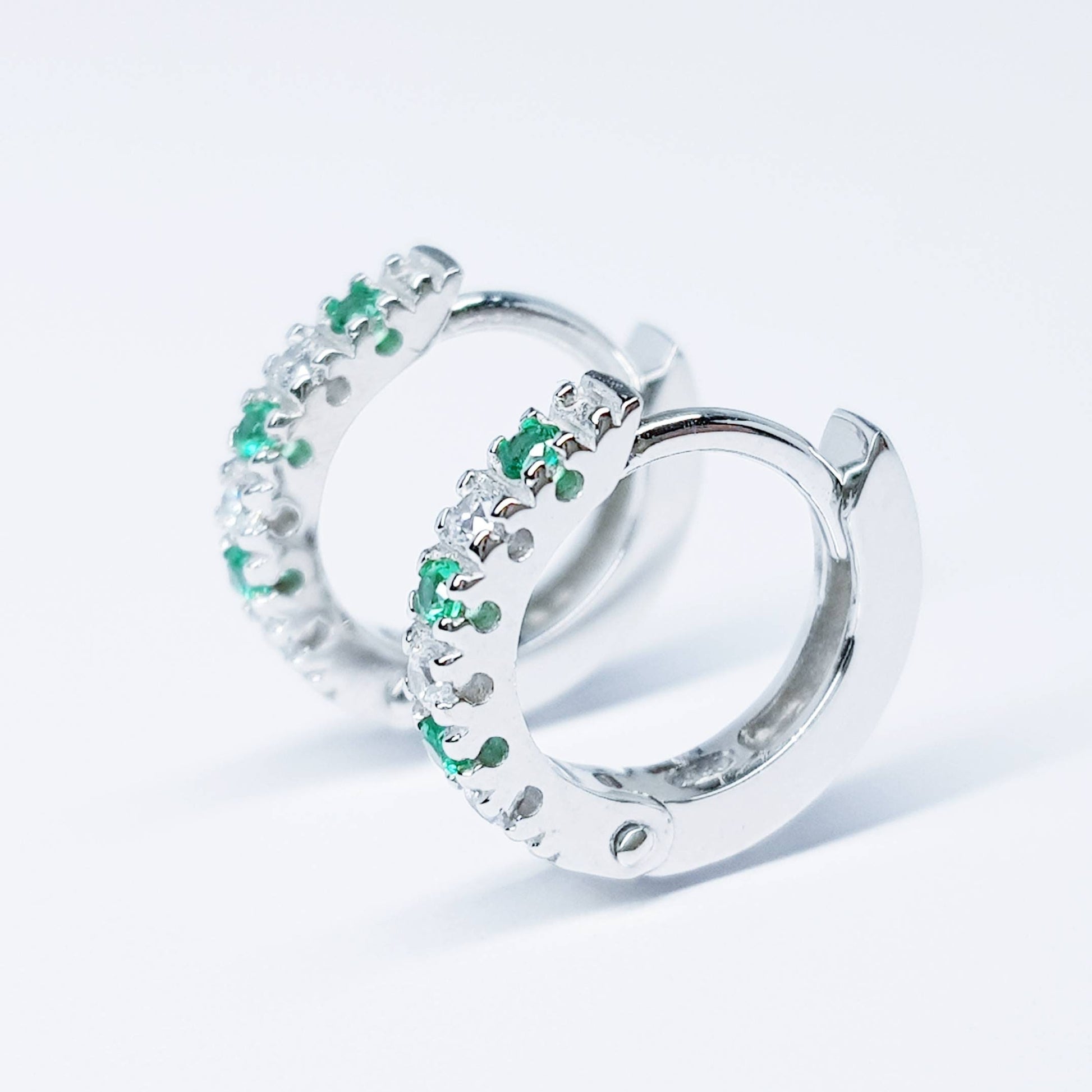 Small silver hoops with green and white CZs, mini hoop earrings, second hole huggies