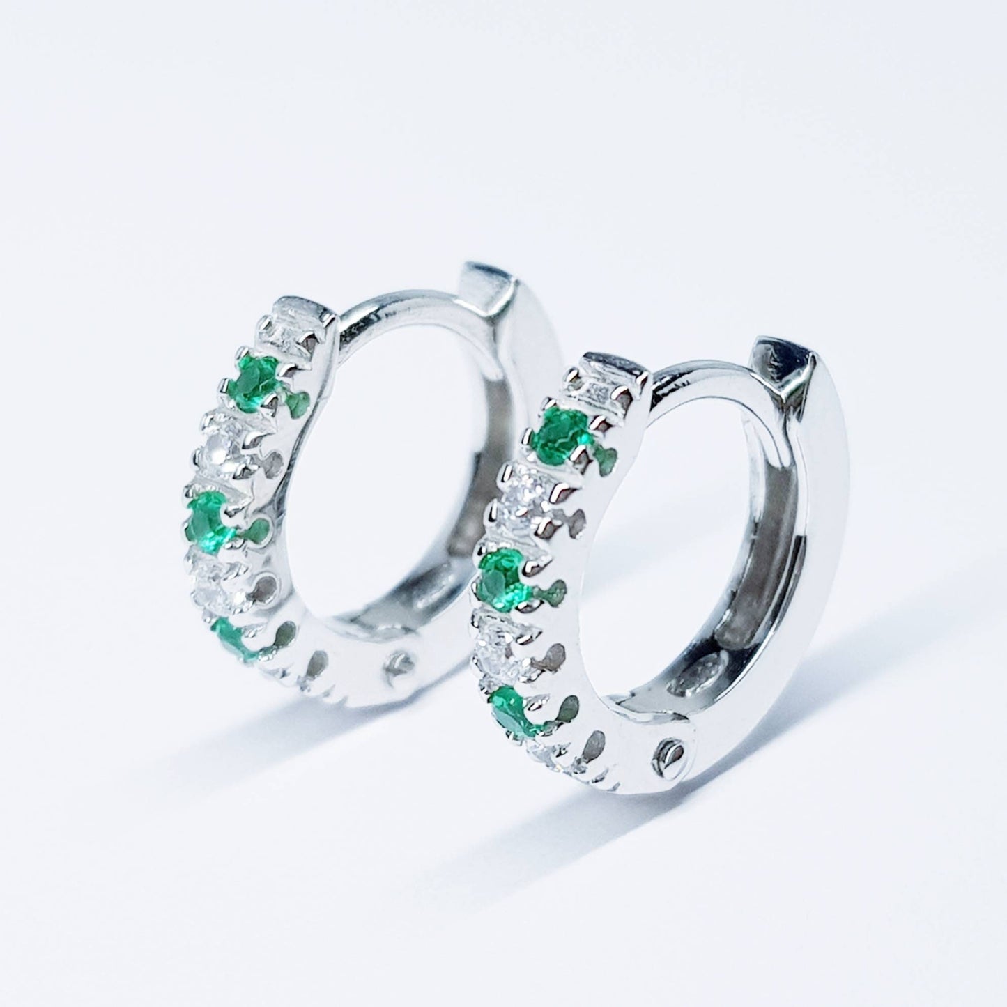 Small silver hoops with green and white CZs, mini hoop earrings, second hole huggies