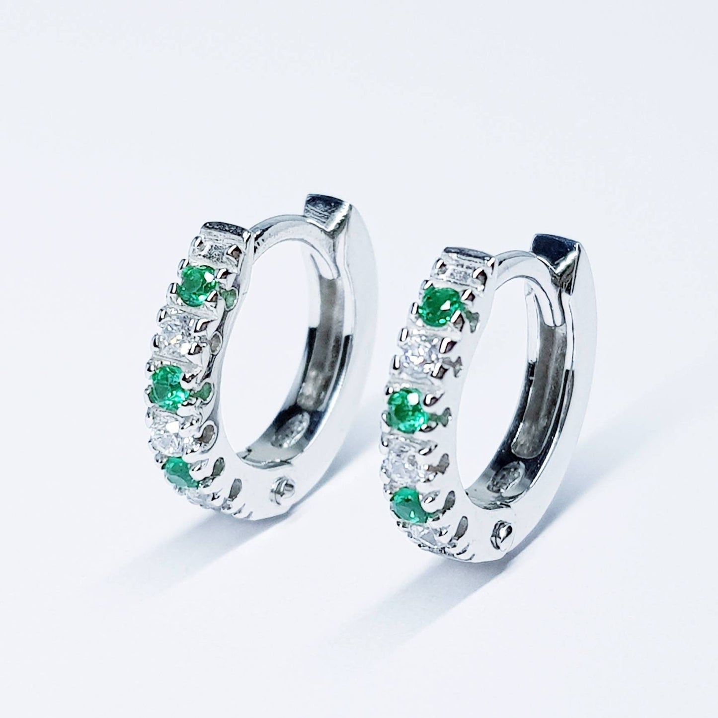 Small silver hoops with green and white CZs, mini hoop earrings, second hole huggies