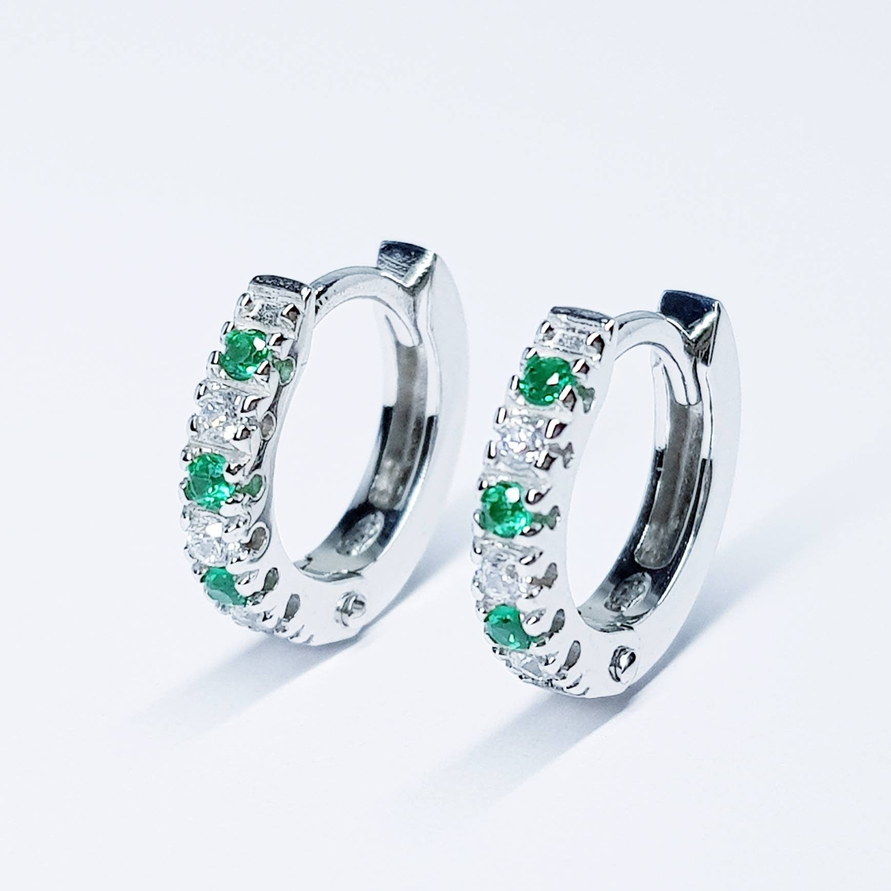 Small silver hoops with green and white CZs, mini hoop earrings, second hole huggies
