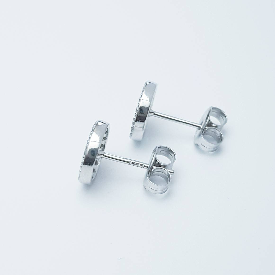 Flat round sterling silver blue stud earrings, pavé set blue earrings