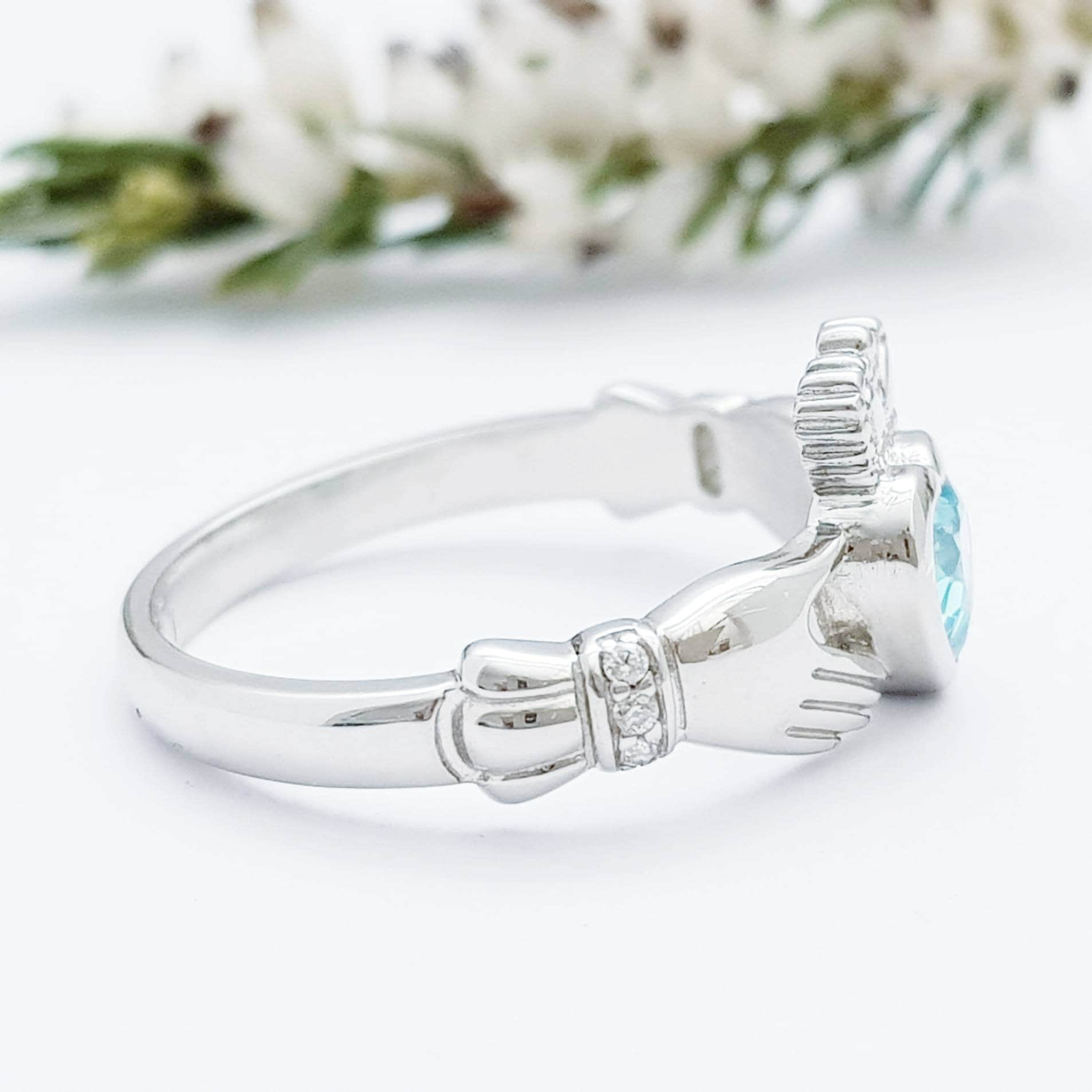 Sterling Silver Claddagh ring set with electric blue heart shaped stone, Irish claddagh rings