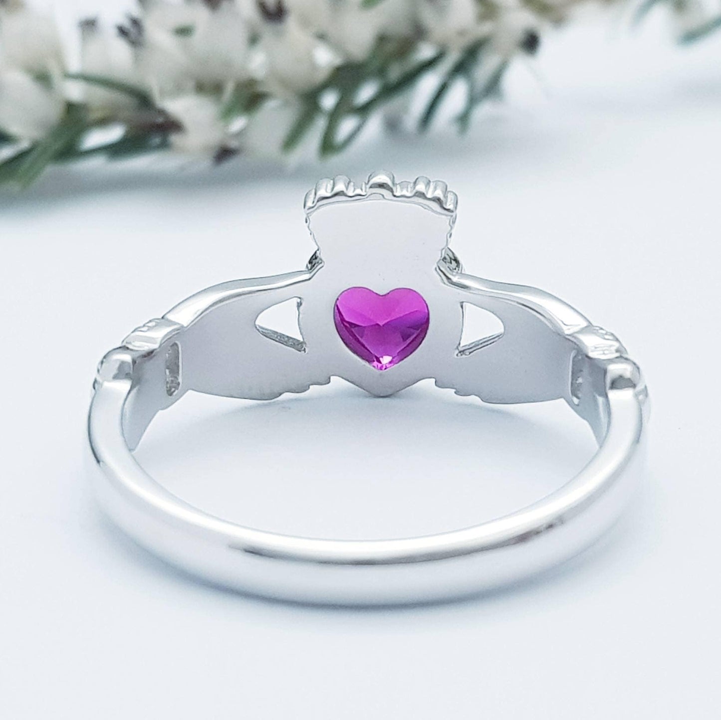 Sterling Silver Claddagh ring set with ruby red heart shaped stone, July birthstone claddagh ring