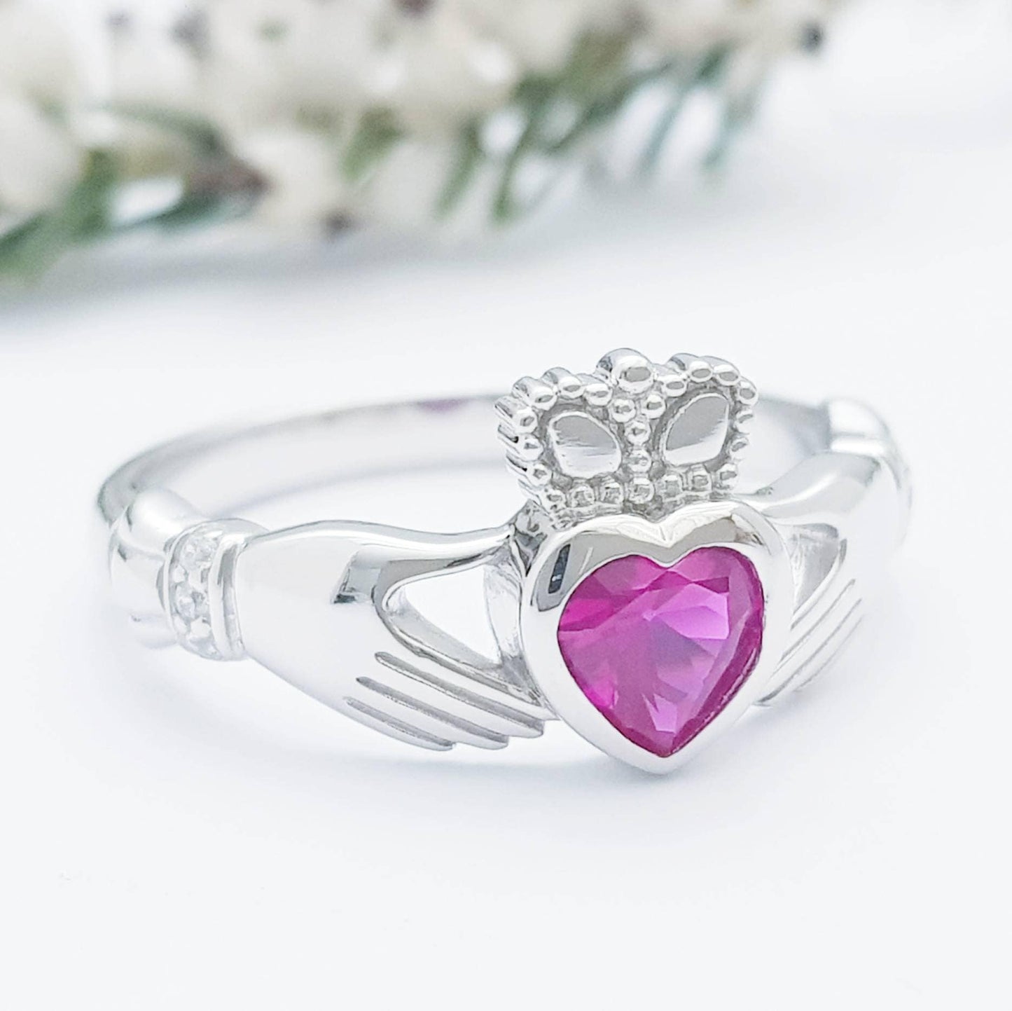 Sterling Silver Claddagh ring set with ruby red heart shaped stone, July birthstone claddagh ring