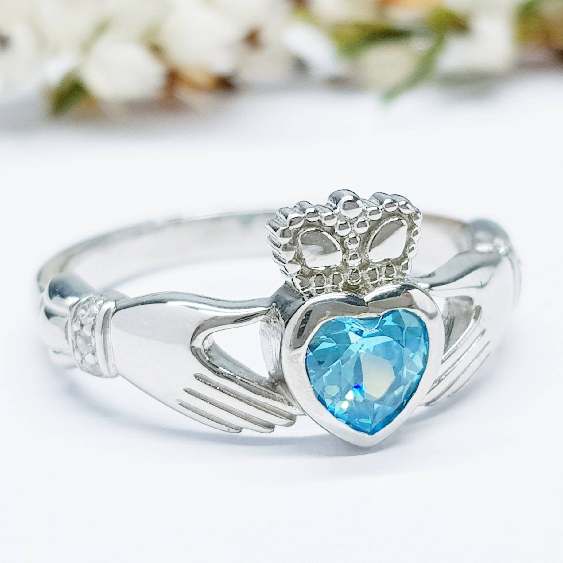 Sterling Silver Claddagh ring set with electric blue heart shaped stone, Irish claddagh rings