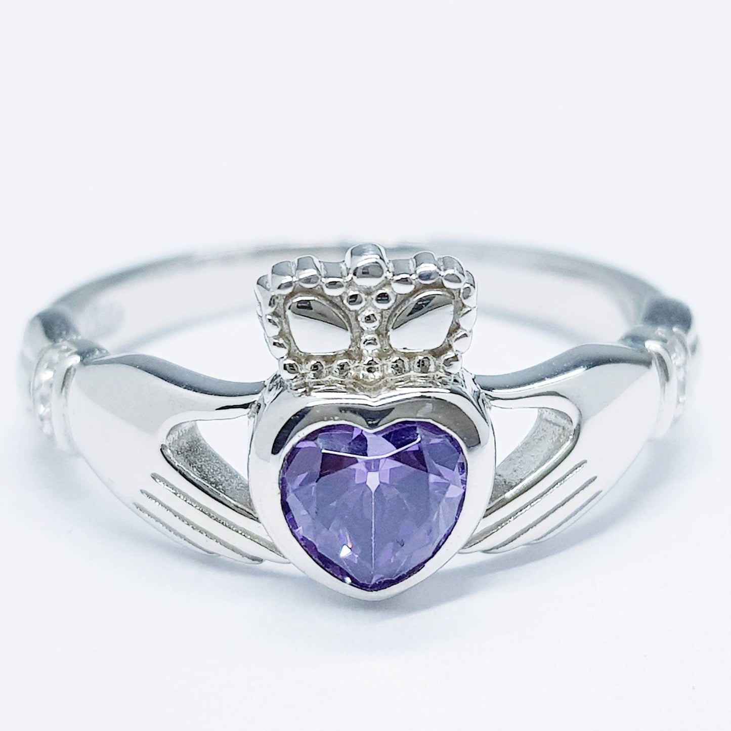 Sterling Silver Claddagh ring set with purple heart shaped stone, february birthstone claddagh