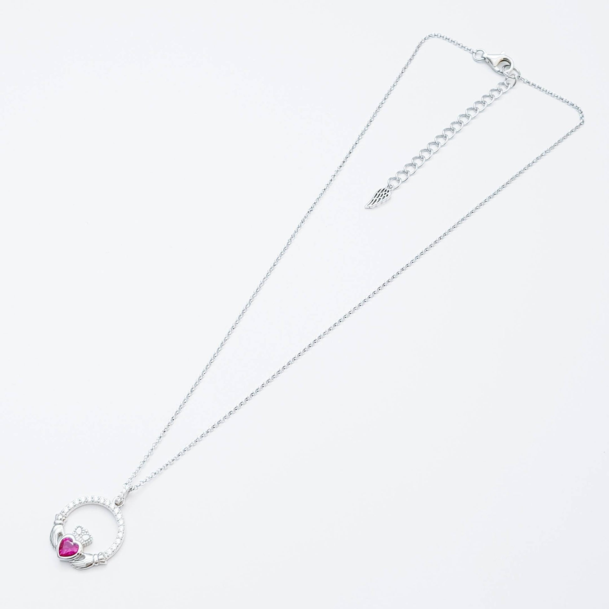 Sterling silver claddagh necklace set with ruby red July birthstone from Ireland