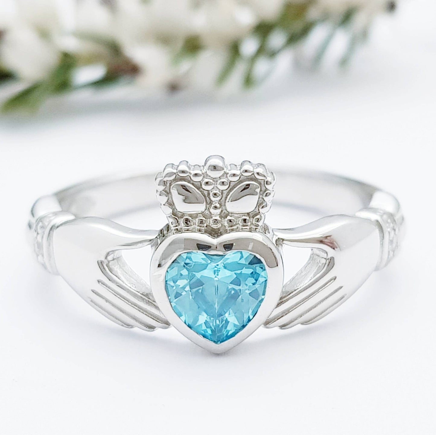 Sterling Silver Claddagh ring set with electric blue heart shaped stone, Irish claddagh rings