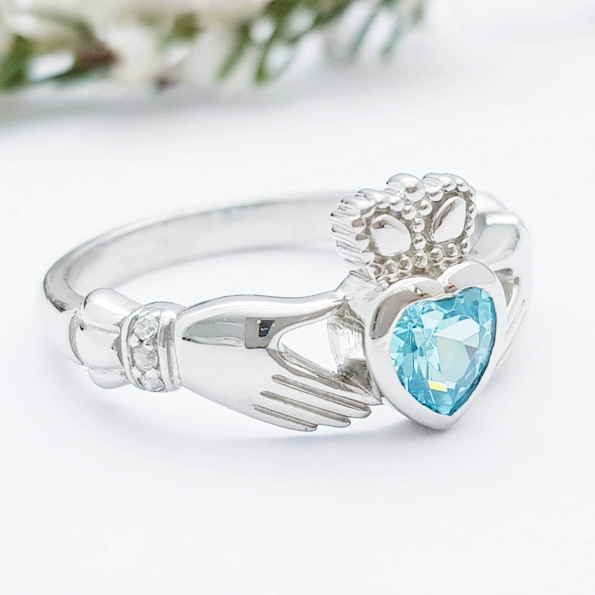 Sterling Silver Claddagh ring set with electric blue heart shaped stone, Irish claddagh rings