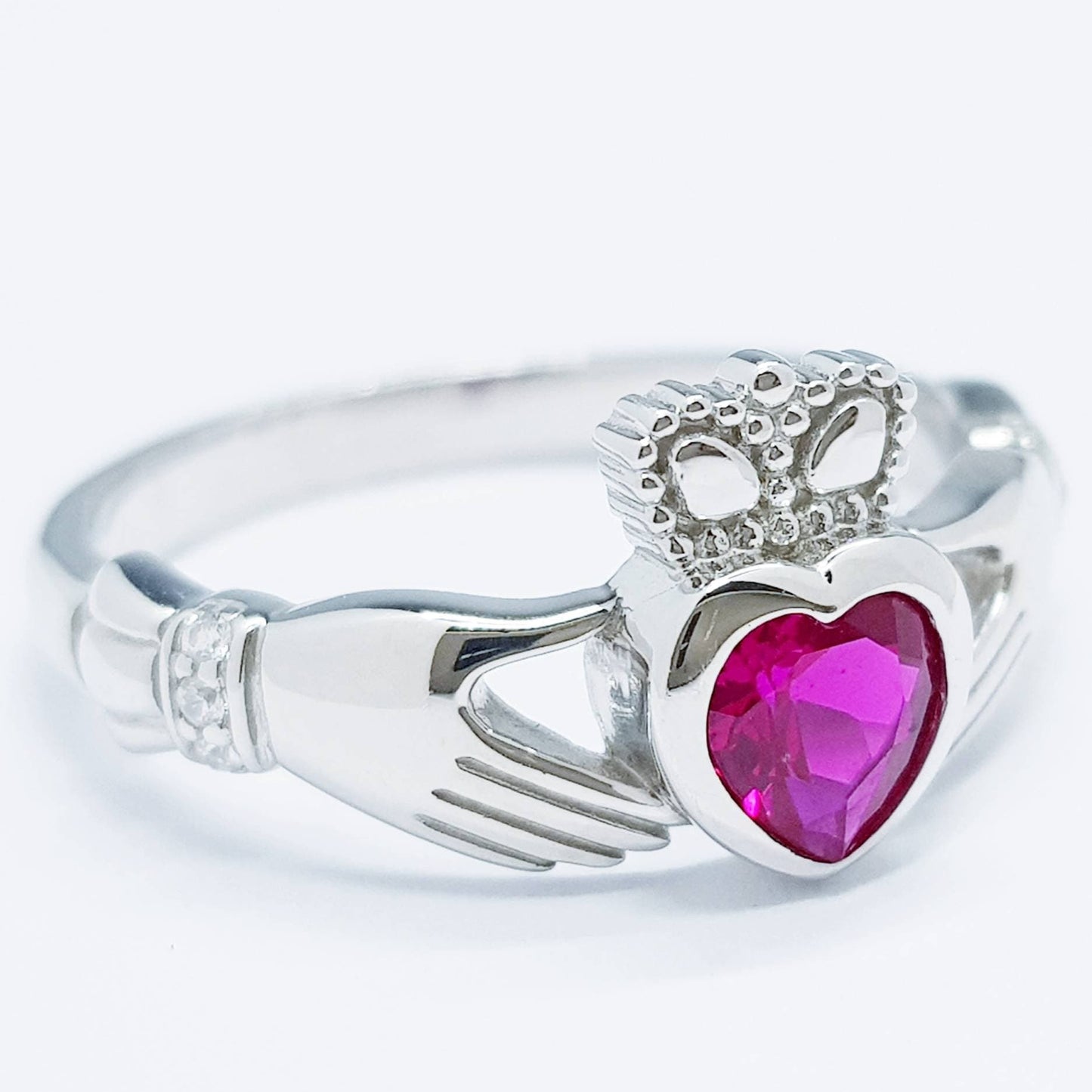 Sterling Silver Claddagh ring set with ruby red heart shaped stone, July birthstone claddagh ring