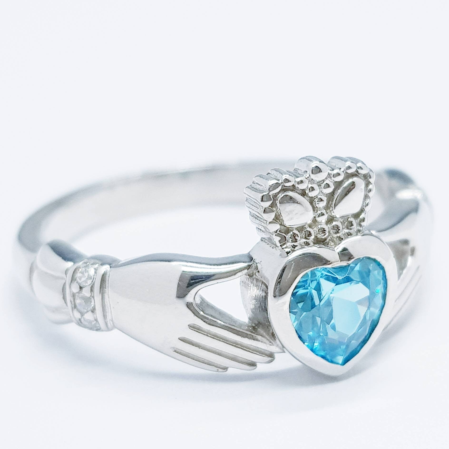 Sterling Silver Claddagh ring set with electric blue heart shaped stone, Irish claddagh rings