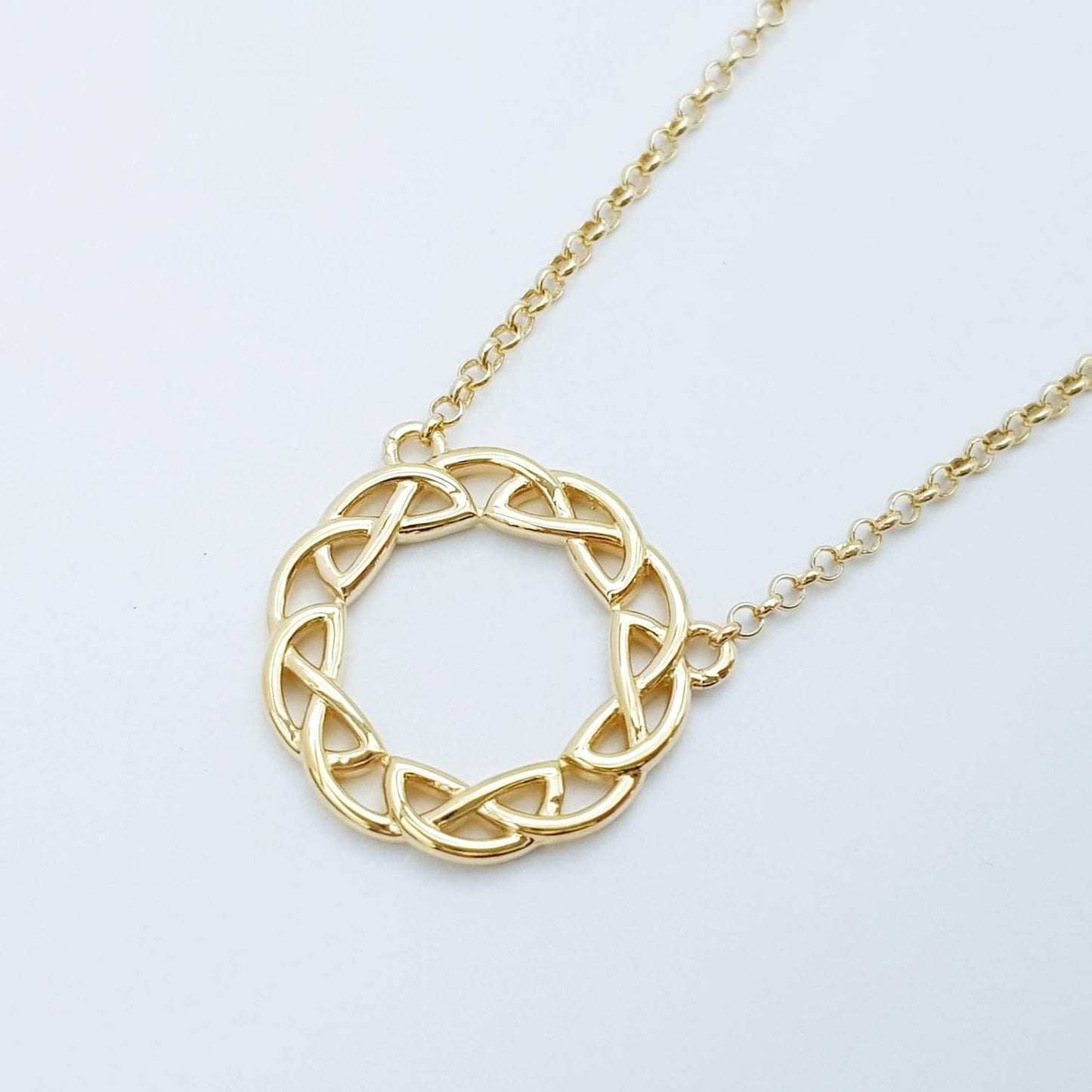Sterling silver celtic knot pendant, gold round celtic necklace made in Ireland with angel wing chain