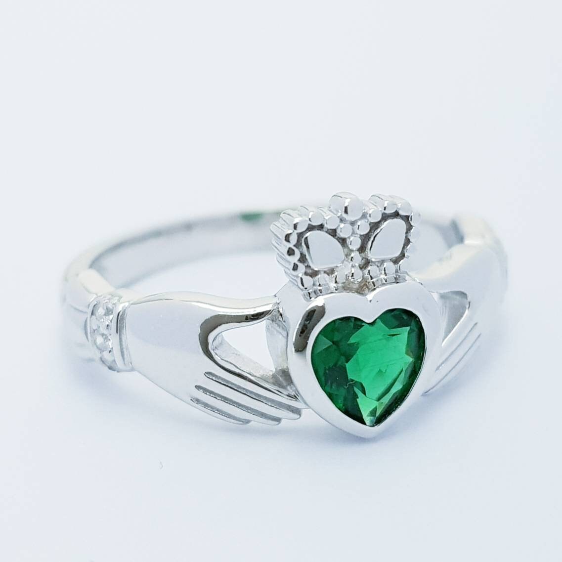 Sterling Silver Claddagh ring set with emerald green heart shaped stone, may birthstone claddagh ring from Ireland