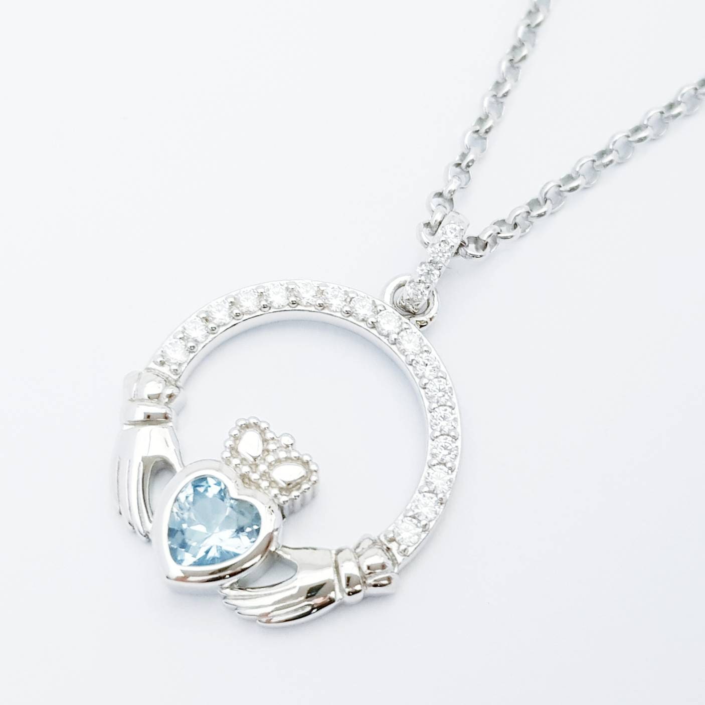 Sterling silver claddagh necklace with light blue aquamarine heart shaped stone, march birthstone