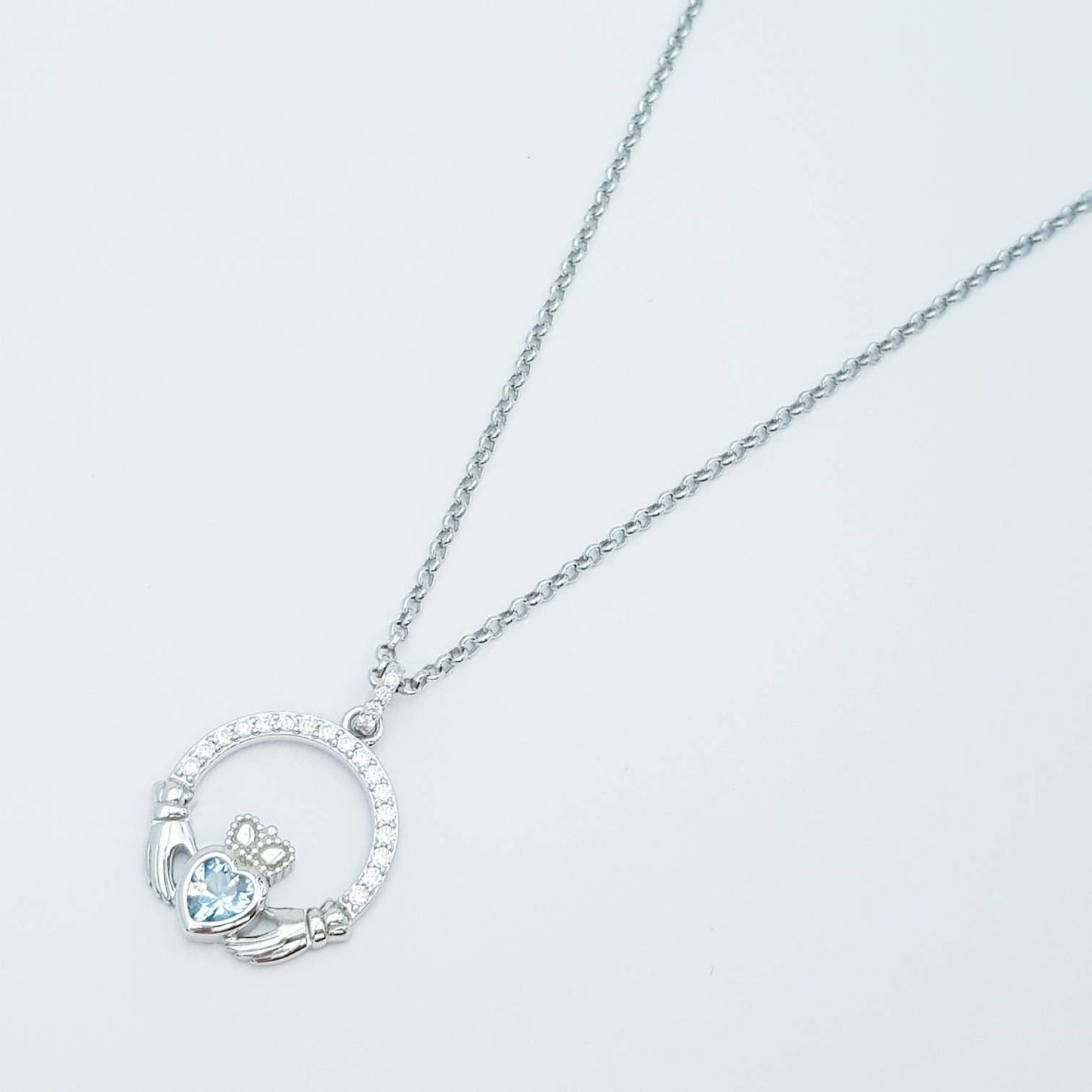 Sterling silver claddagh necklace with light blue aquamarine heart shaped stone, march birthstone