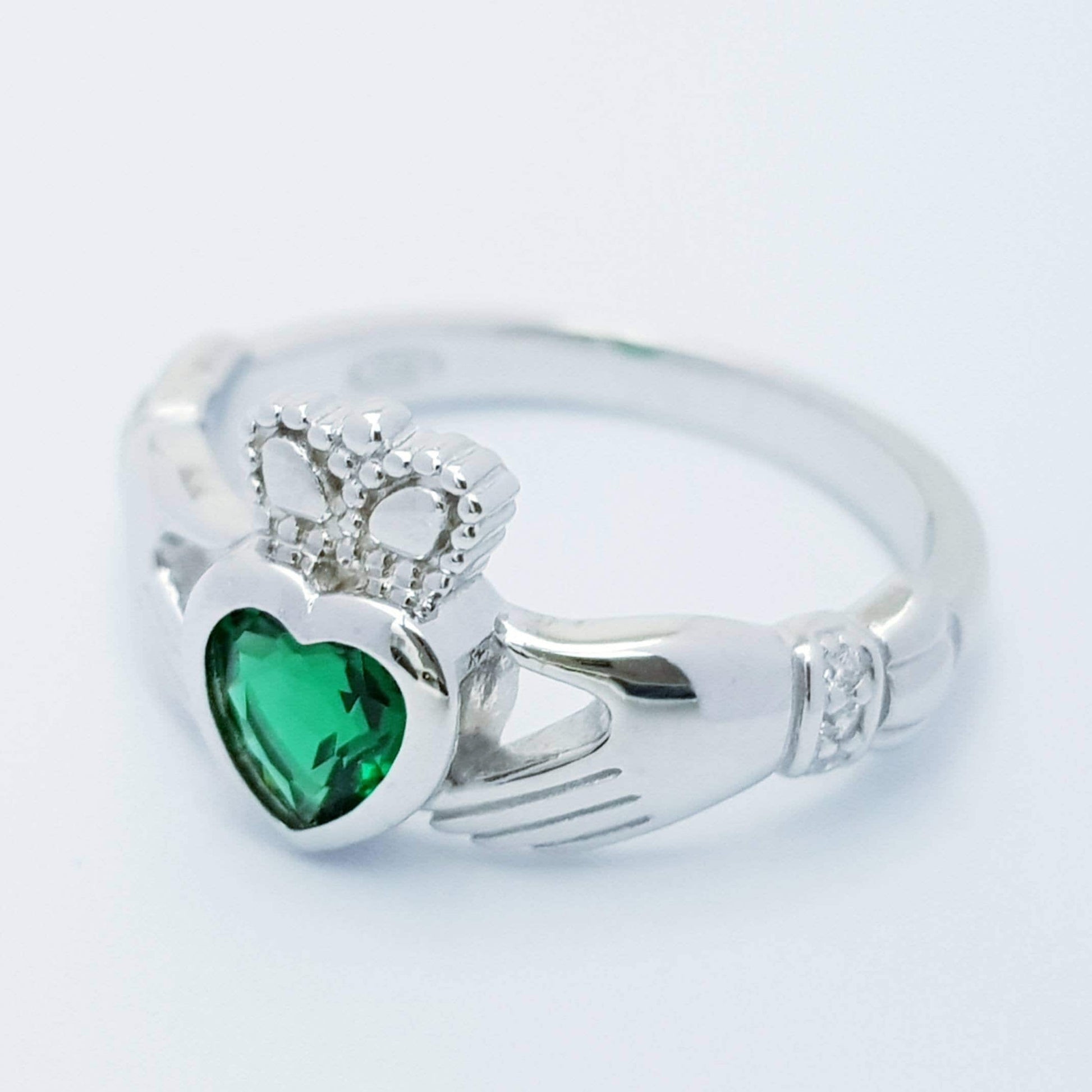 Sterling Silver Claddagh ring set with emerald green heart shaped stone, may birthstone claddagh ring from Ireland