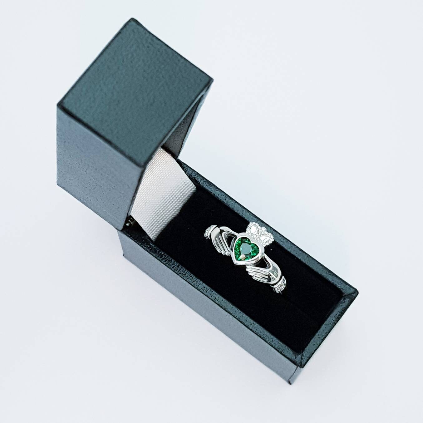 Sterling Silver Claddagh ring set with emerald green heart shaped stone, may birthstone claddagh ring from Ireland