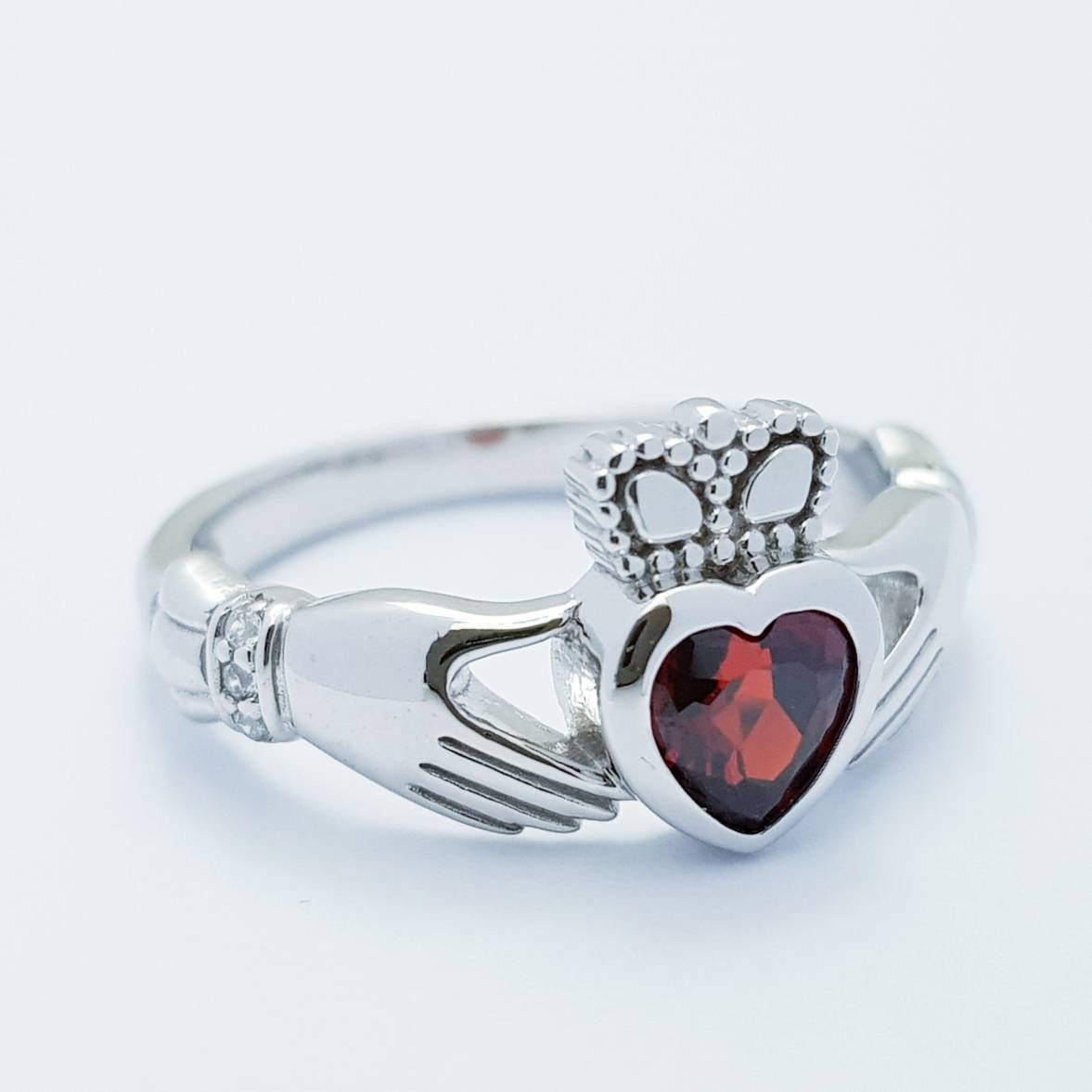 Sterling Silver Claddagh ring set with red garnet heart shaped stone, Irish claddagh rings