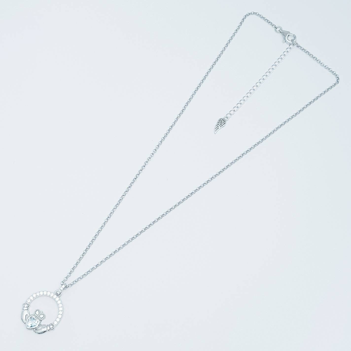 Sterling silver claddagh necklace with light blue aquamarine heart shaped stone, march birthstone