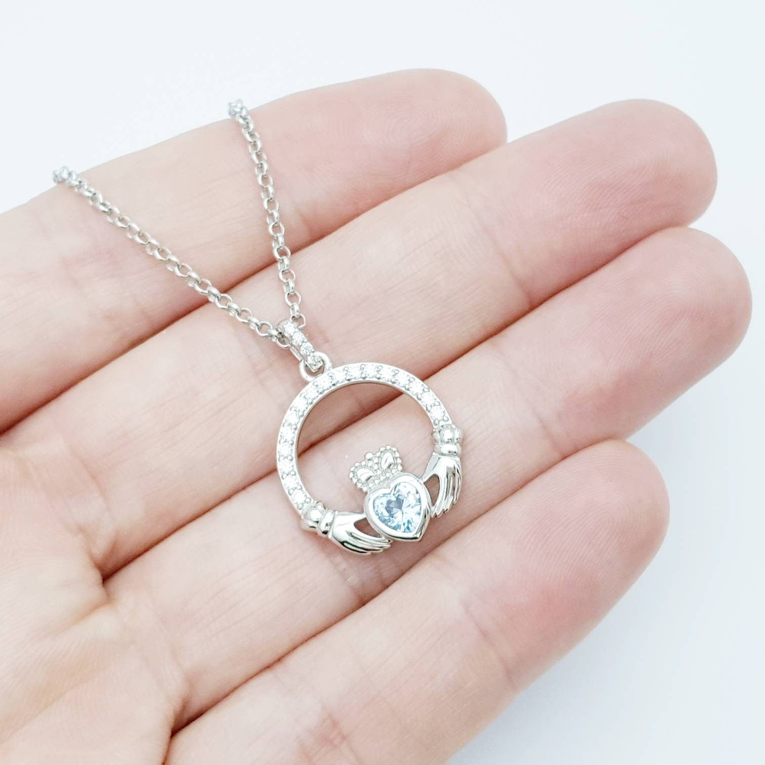 Sterling silver claddagh necklace with light blue aquamarine heart shaped stone, march birthstone