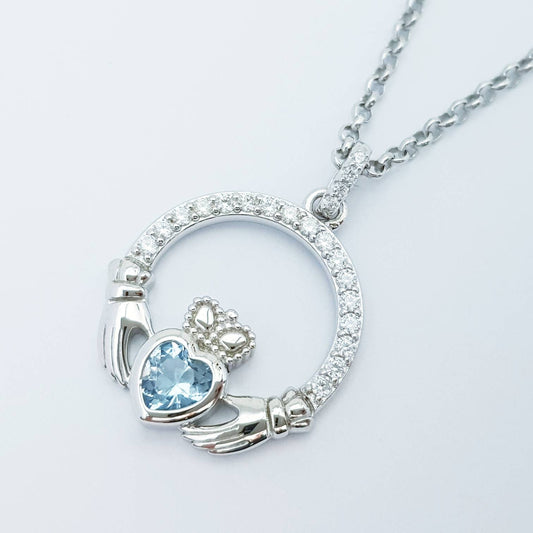 Sterling silver claddagh necklace with light blue aquamarine heart shaped stone, march birthstone