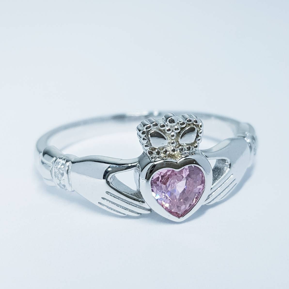 Irish Claddagh ring set with pink heart shaped stone from Galway, Ireland