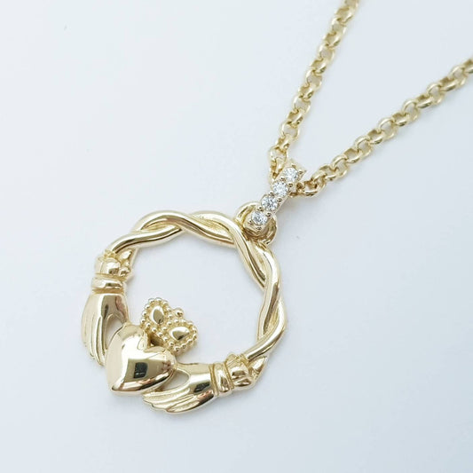 Dainty Sterling Silver claddagh necklace with gold plating and intertwined celtic braid.
