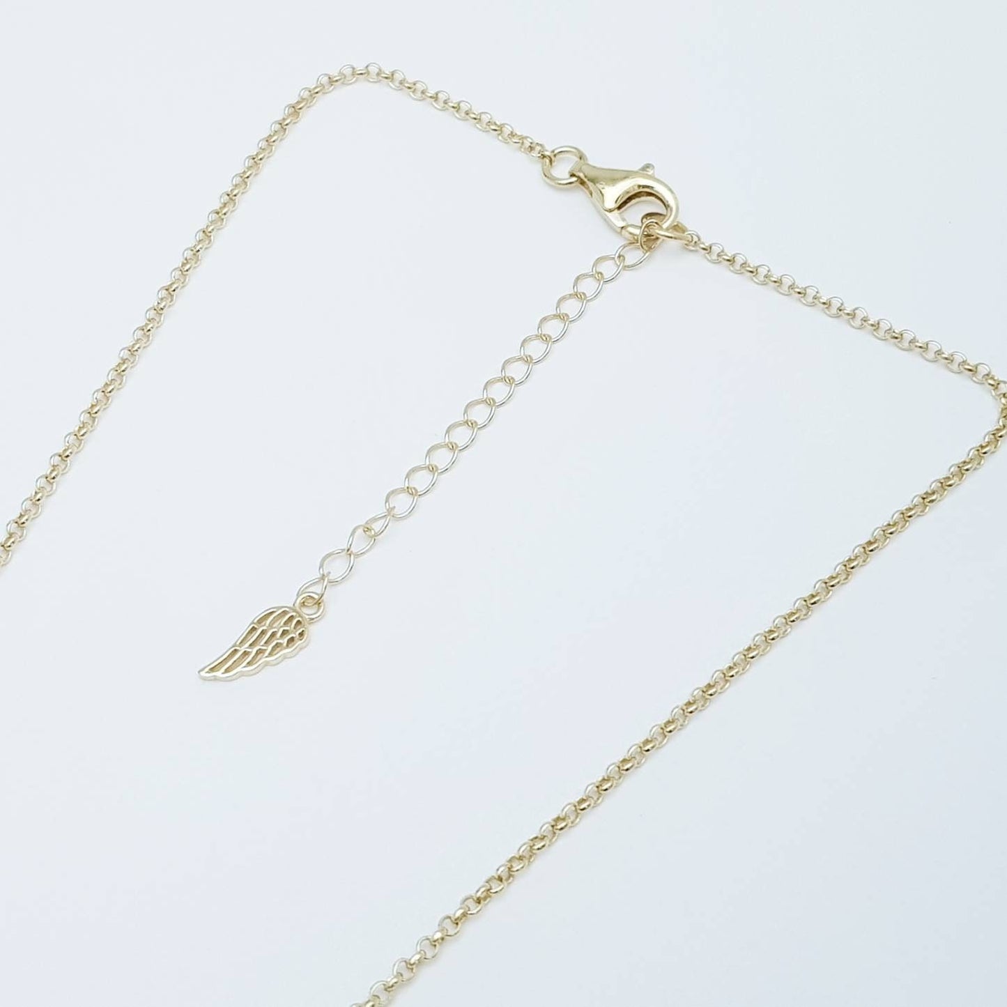 Dainty Sterling Silver claddagh necklace with gold plating and intertwined celtic braid.