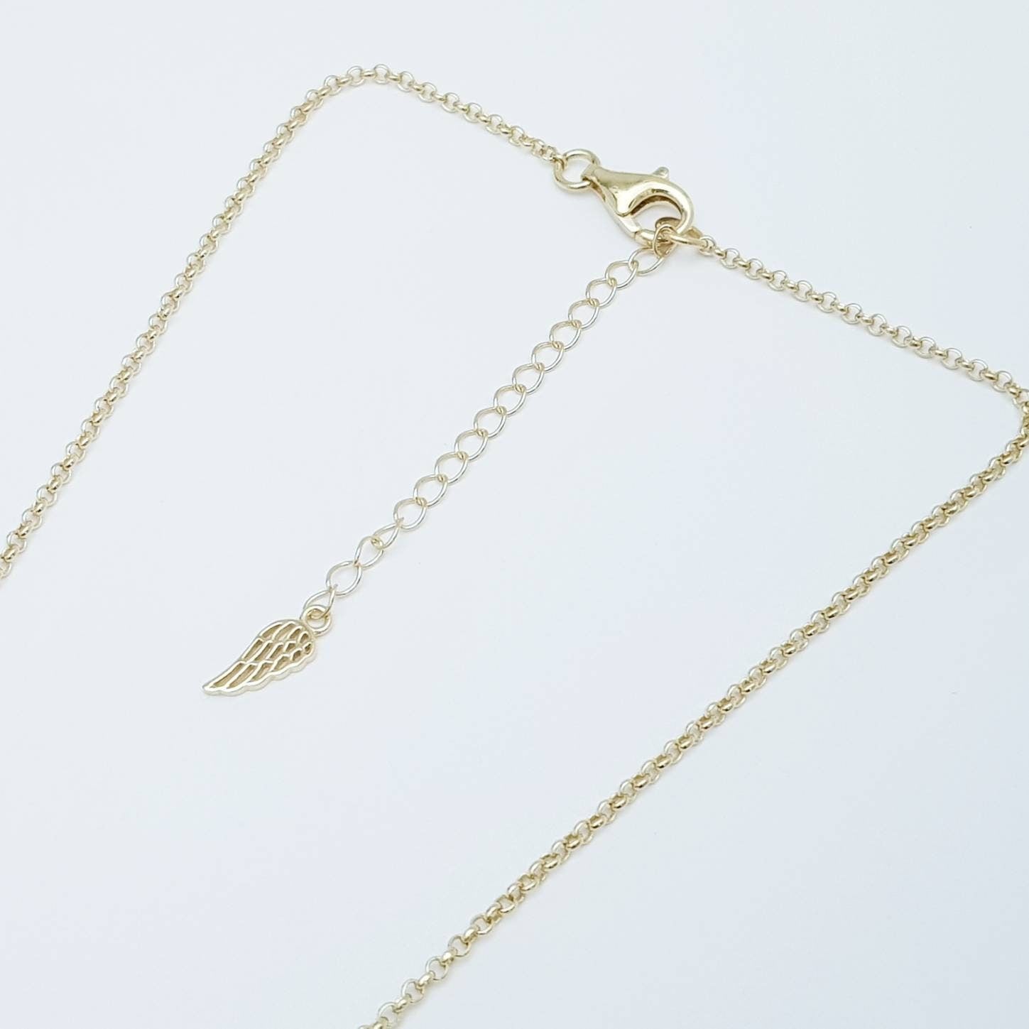 Dainty Sterling Silver claddagh necklace with gold plating and intertwined celtic braid.