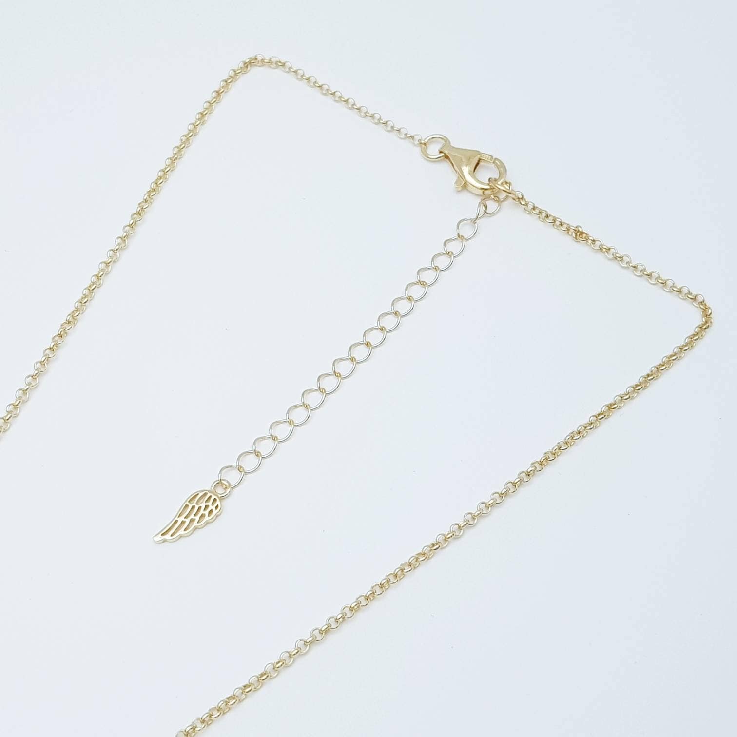 Silver and gold claddagh pendant with Aquamarine blue stone