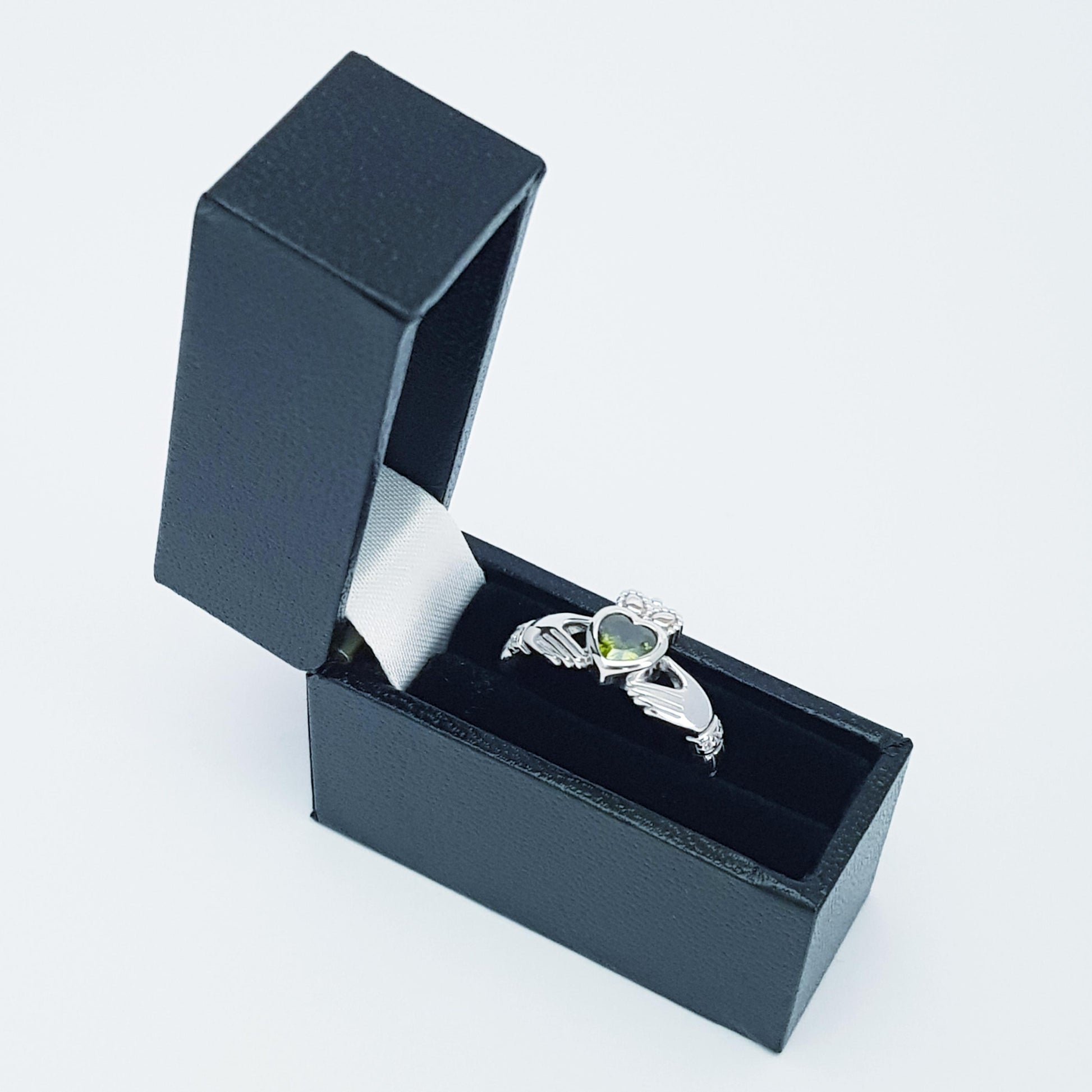Irish Claddagh ring set with green peridot heart shaped stone from Galway, Ireland
