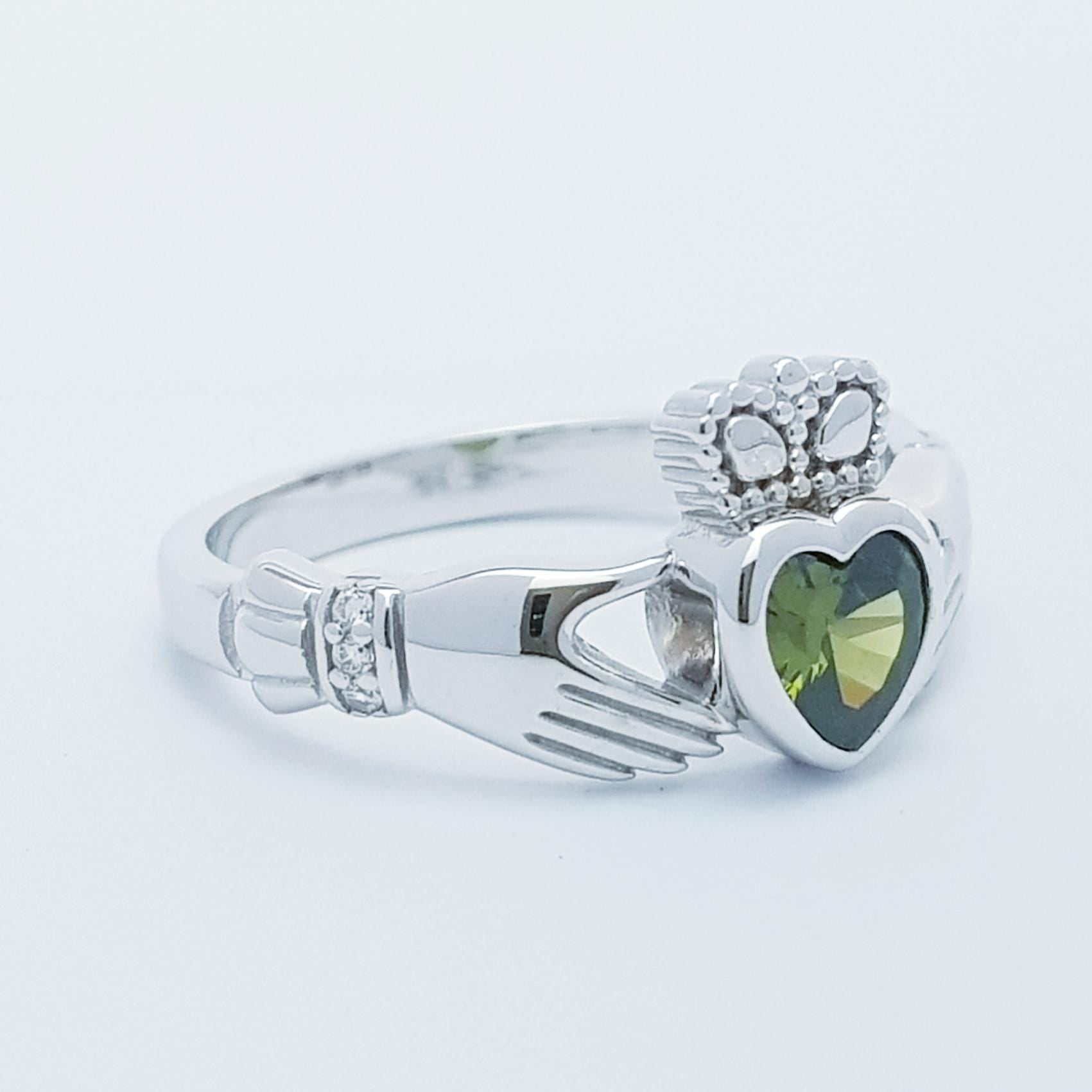 Irish Claddagh ring set with green peridot heart shaped stone from Galway, Ireland
