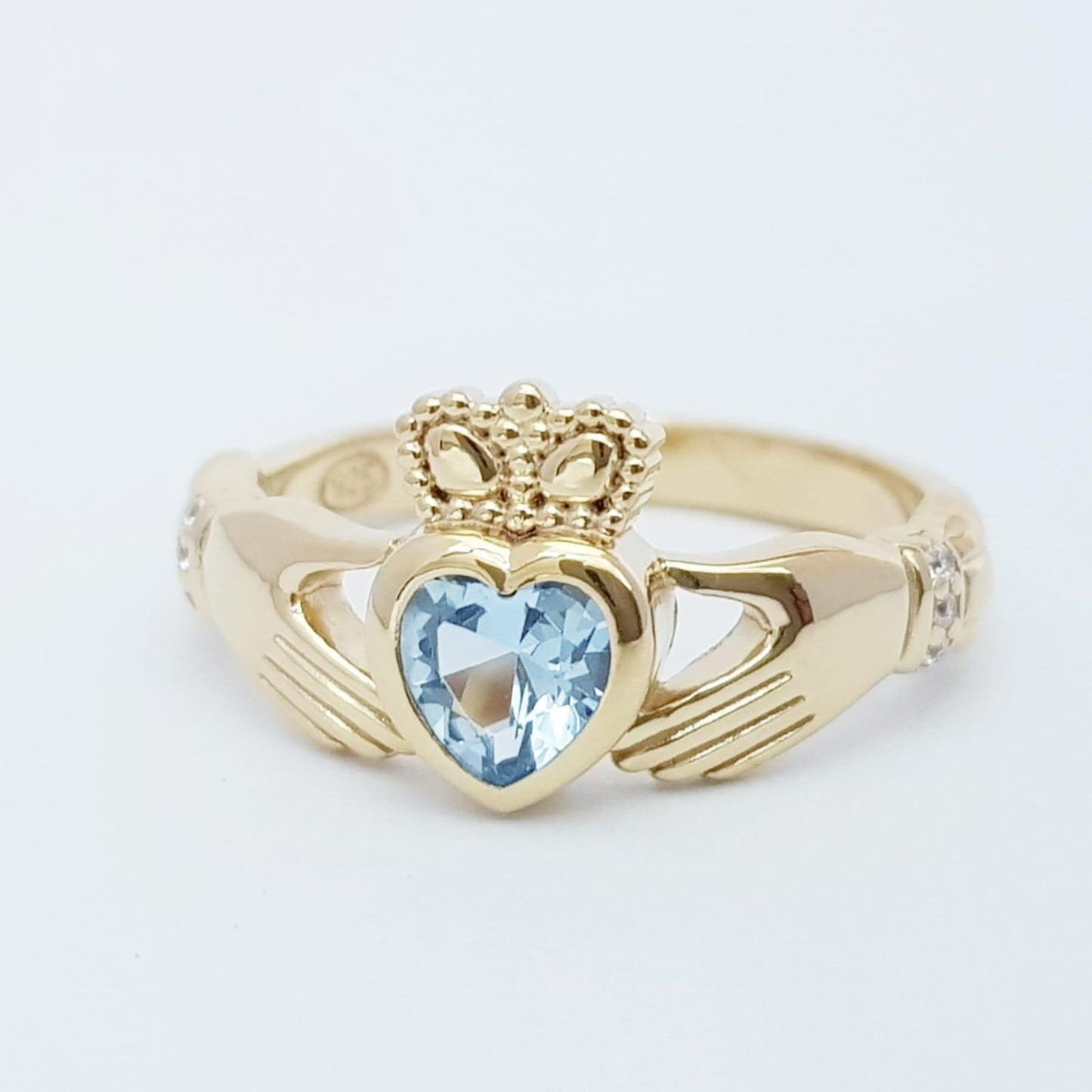 Sterling Silver Yellow Gold plated Claddagh ring set with aquamarine heart shaped stone, may birthstone claddagh ring from Ireland