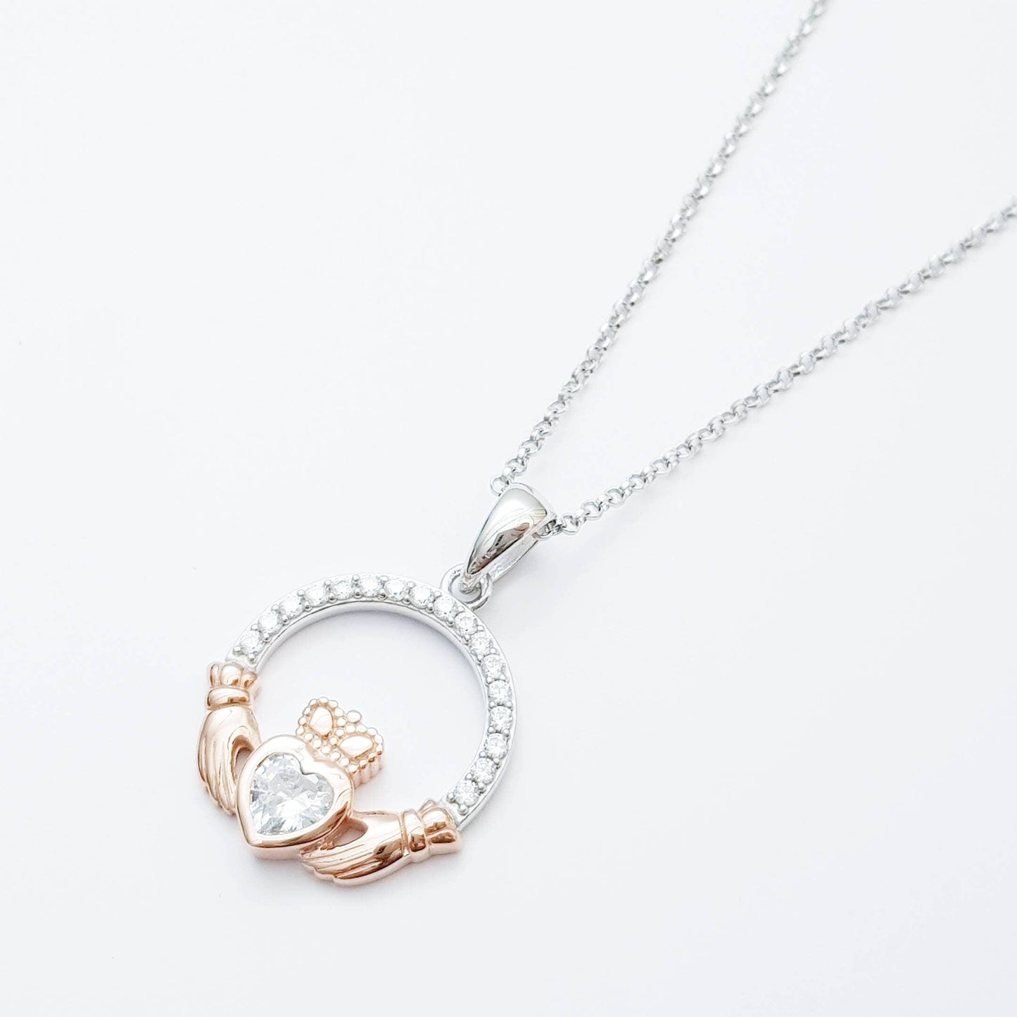 Sterling silver april birthstone claddagh necklace with rose gold