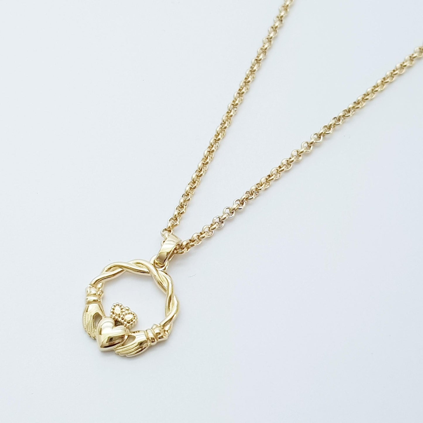 Small Sterling Silver claddagh necklace with gold plating and celtic braid.