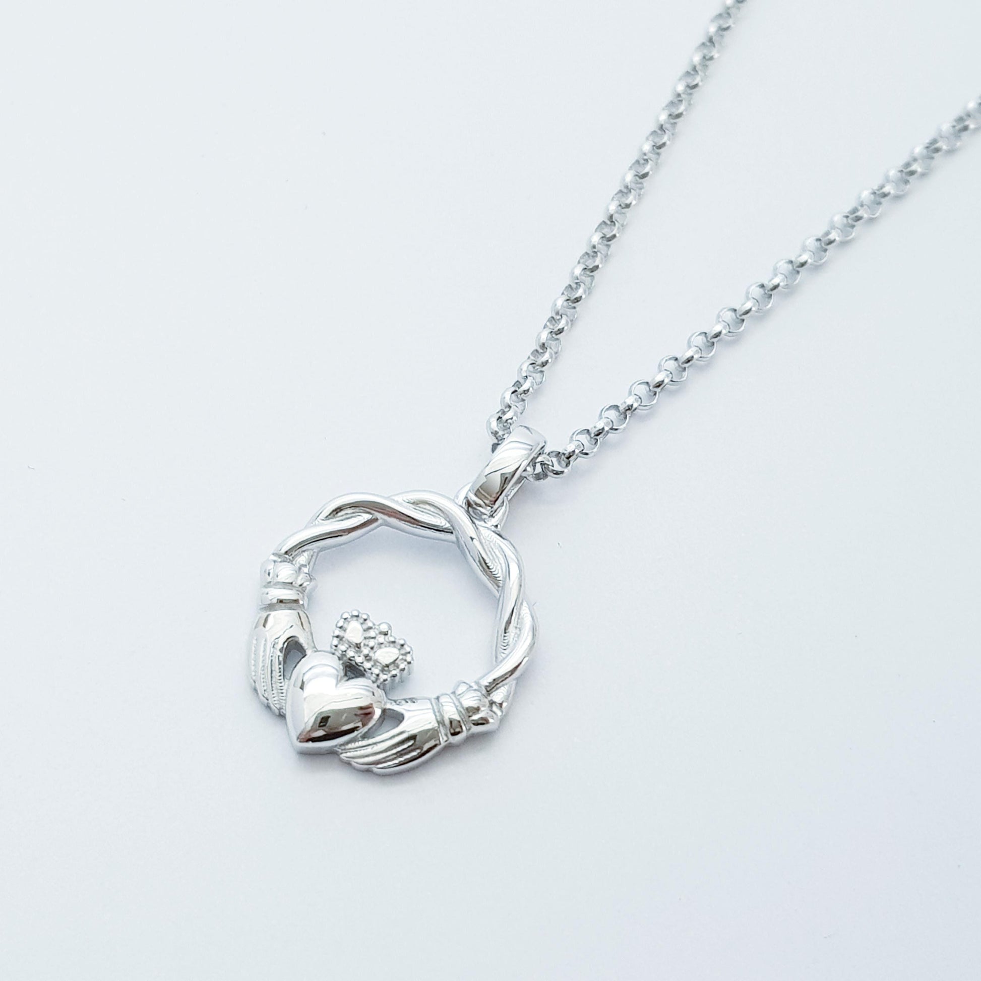 Small Sterling Silver claddagh necklace with gold plating and celtic braid.