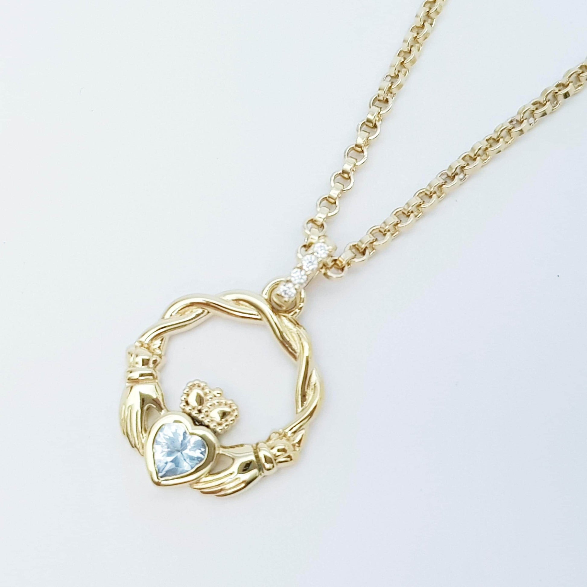 Gold plated sterling silver claddagh necklace set with Aquamarine march birthstone